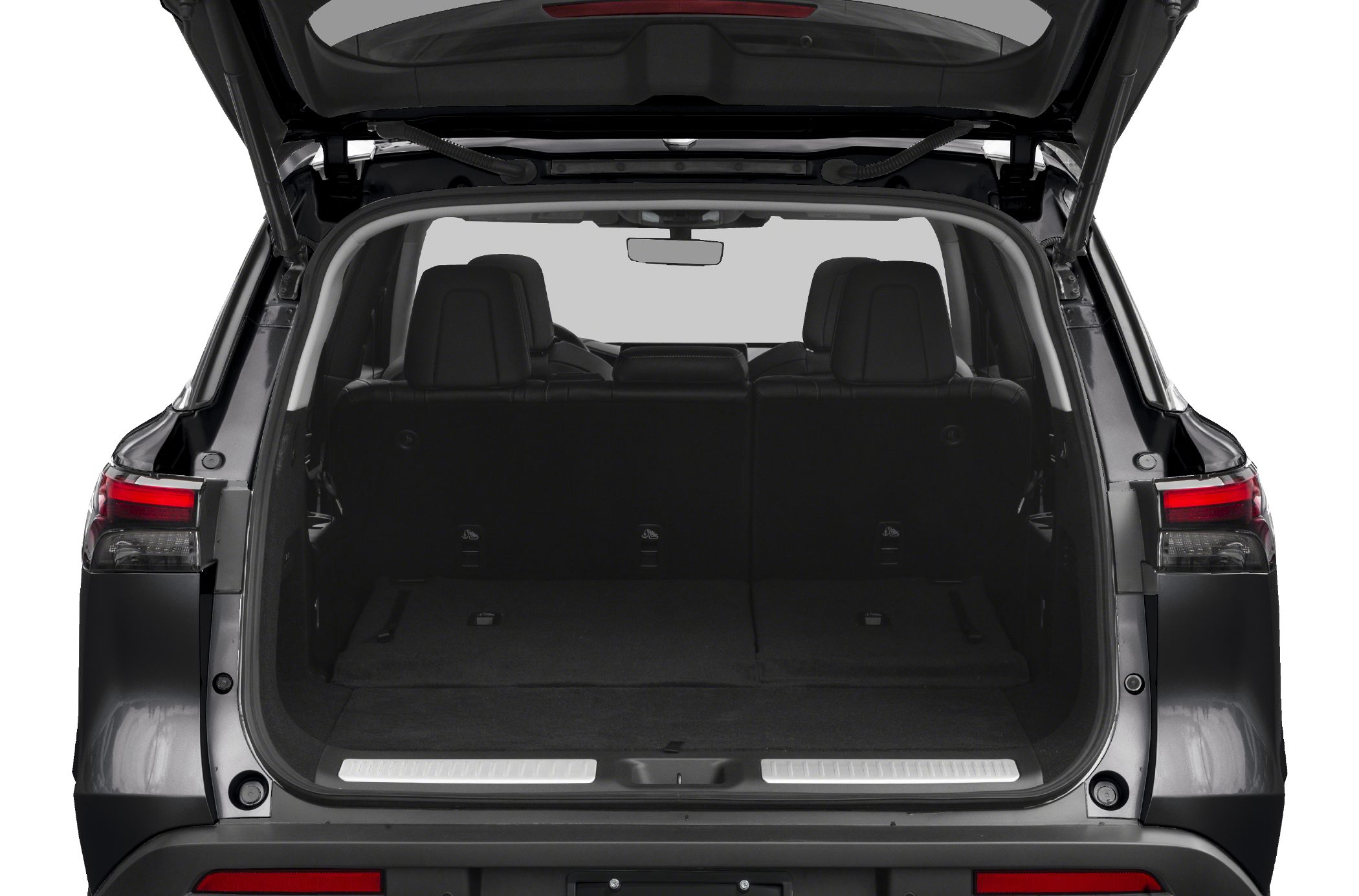 Open rear cargo space of a luxury SUV with rear seats up