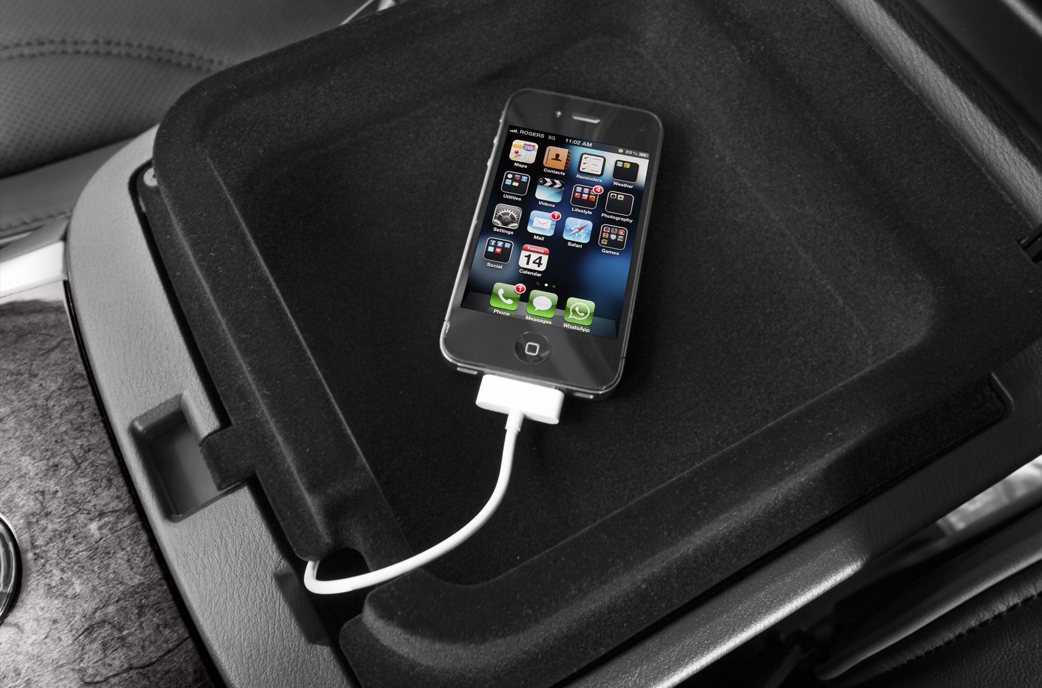 Spacious center console compartment with smartphone charging cable