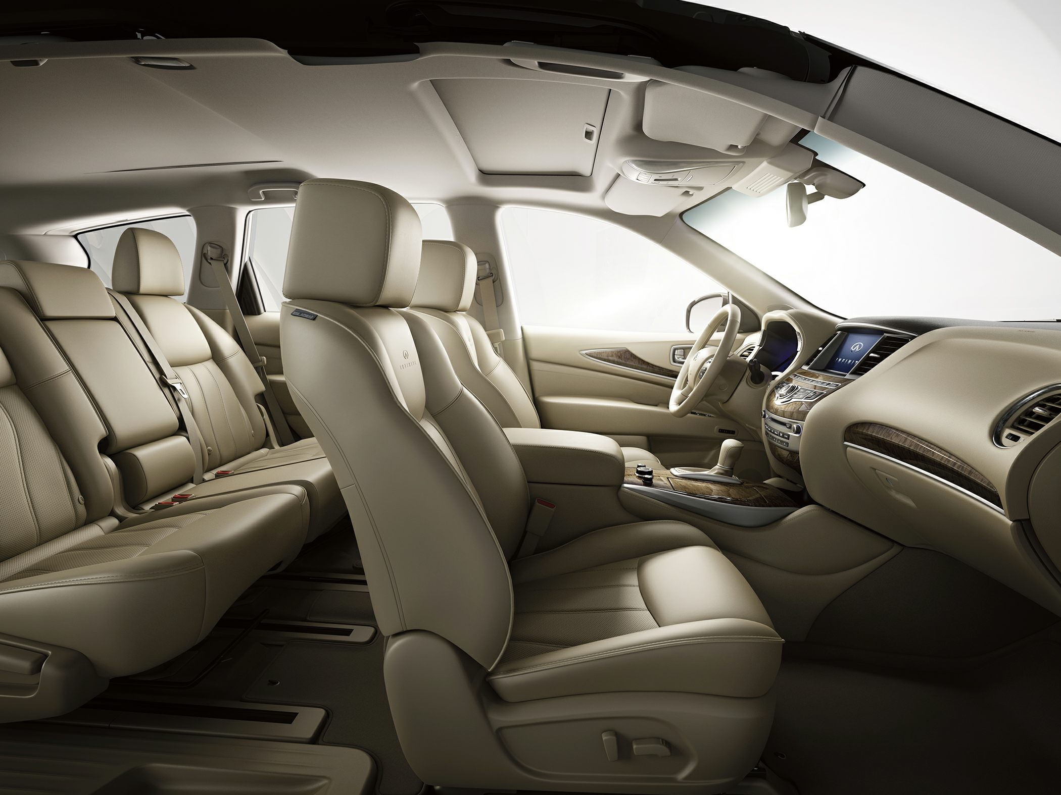 Beige leather luxury seats and wood-trimmed dashboard