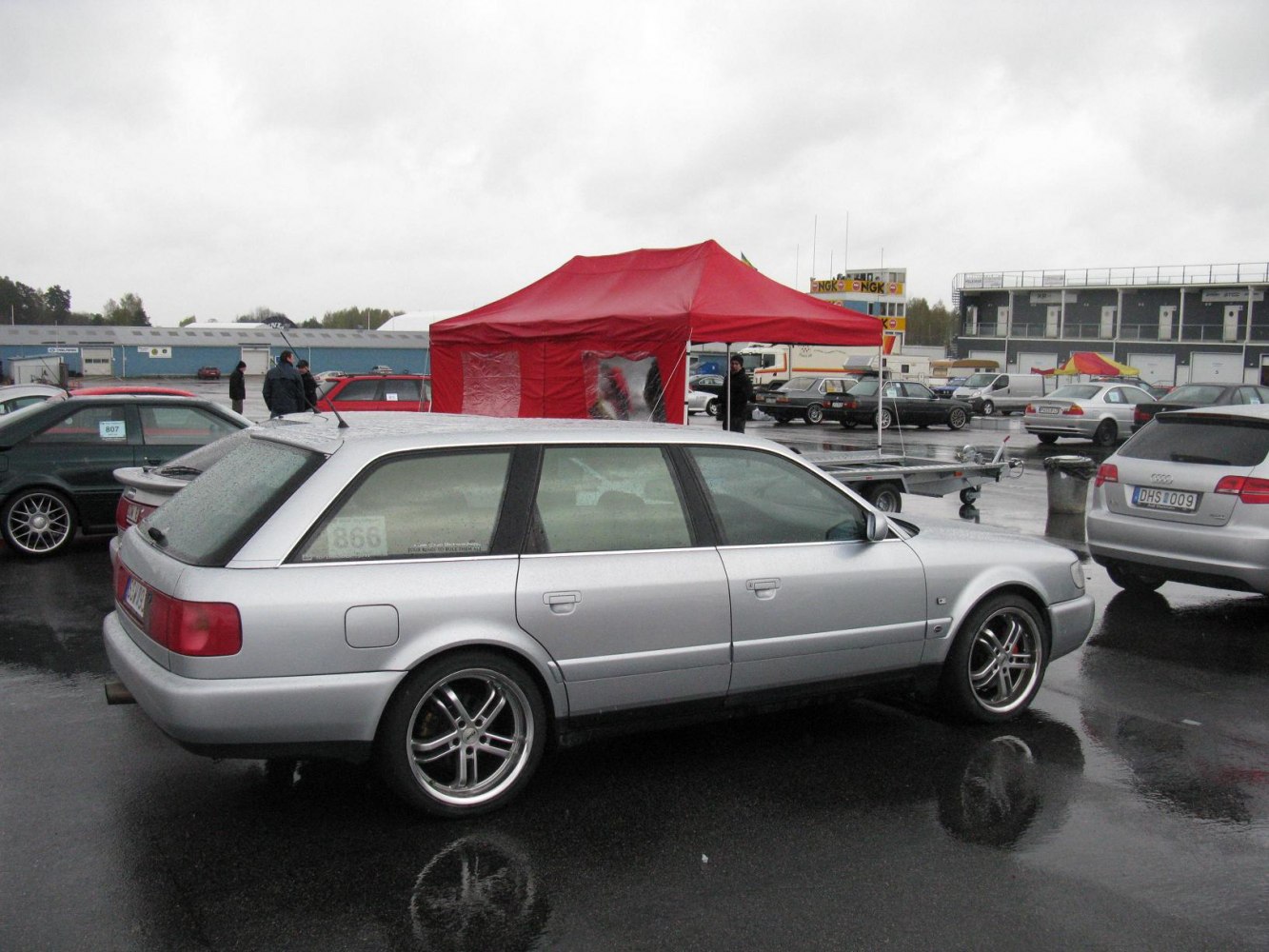 Silver station wagon with alloy wheels side profile