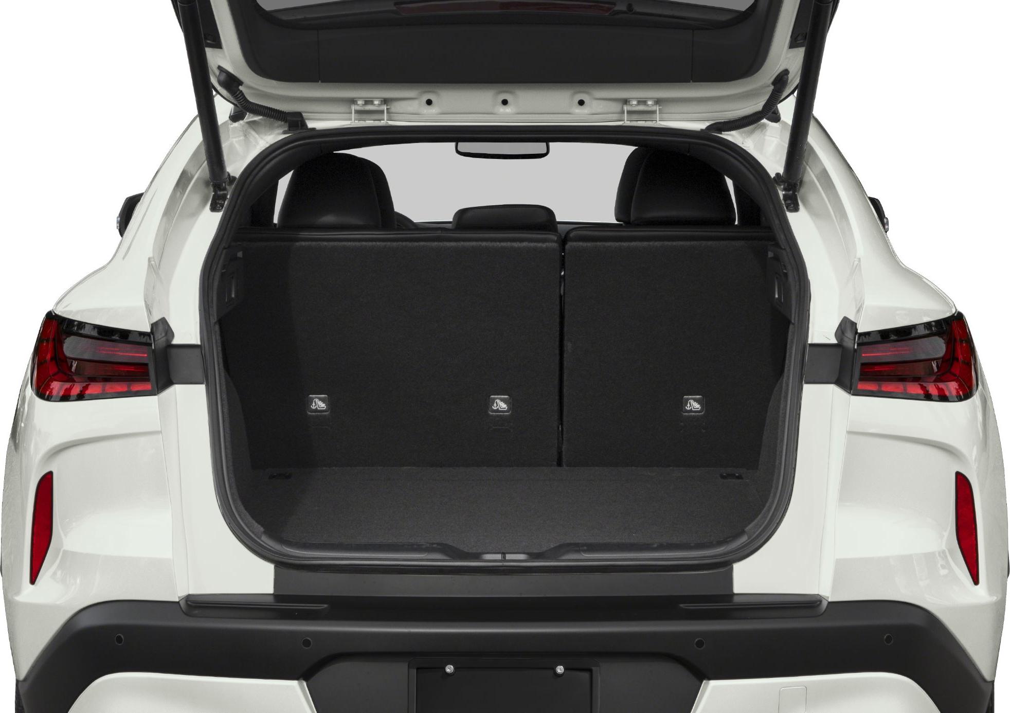 Open trunk with split rear seats and modern LED tail lights.