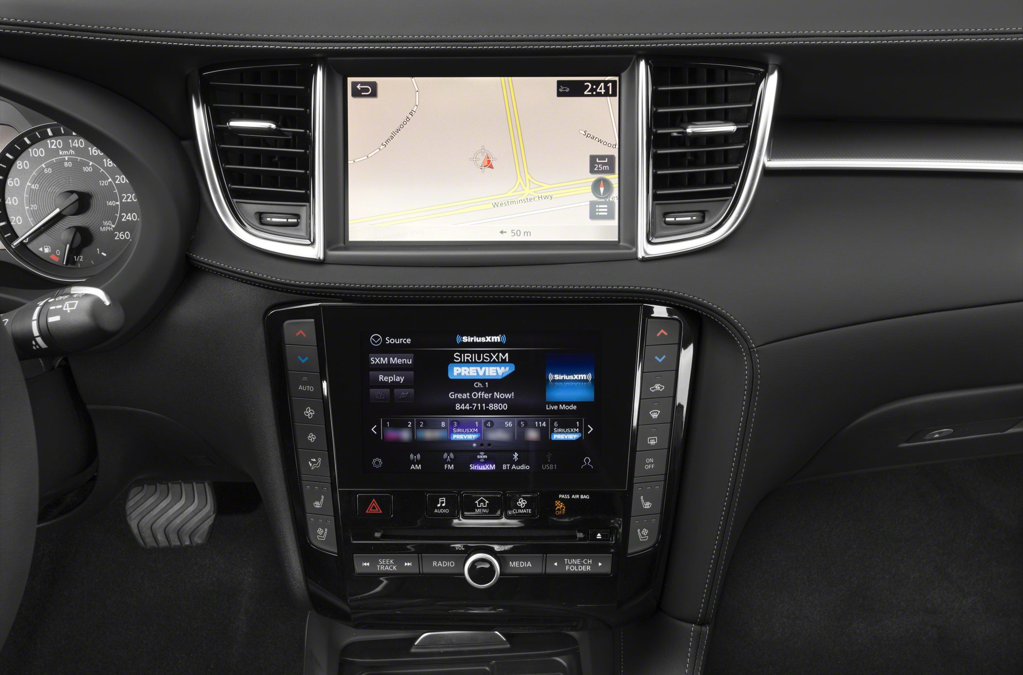 Dual-screen dashboard with navigation and infotainment controls