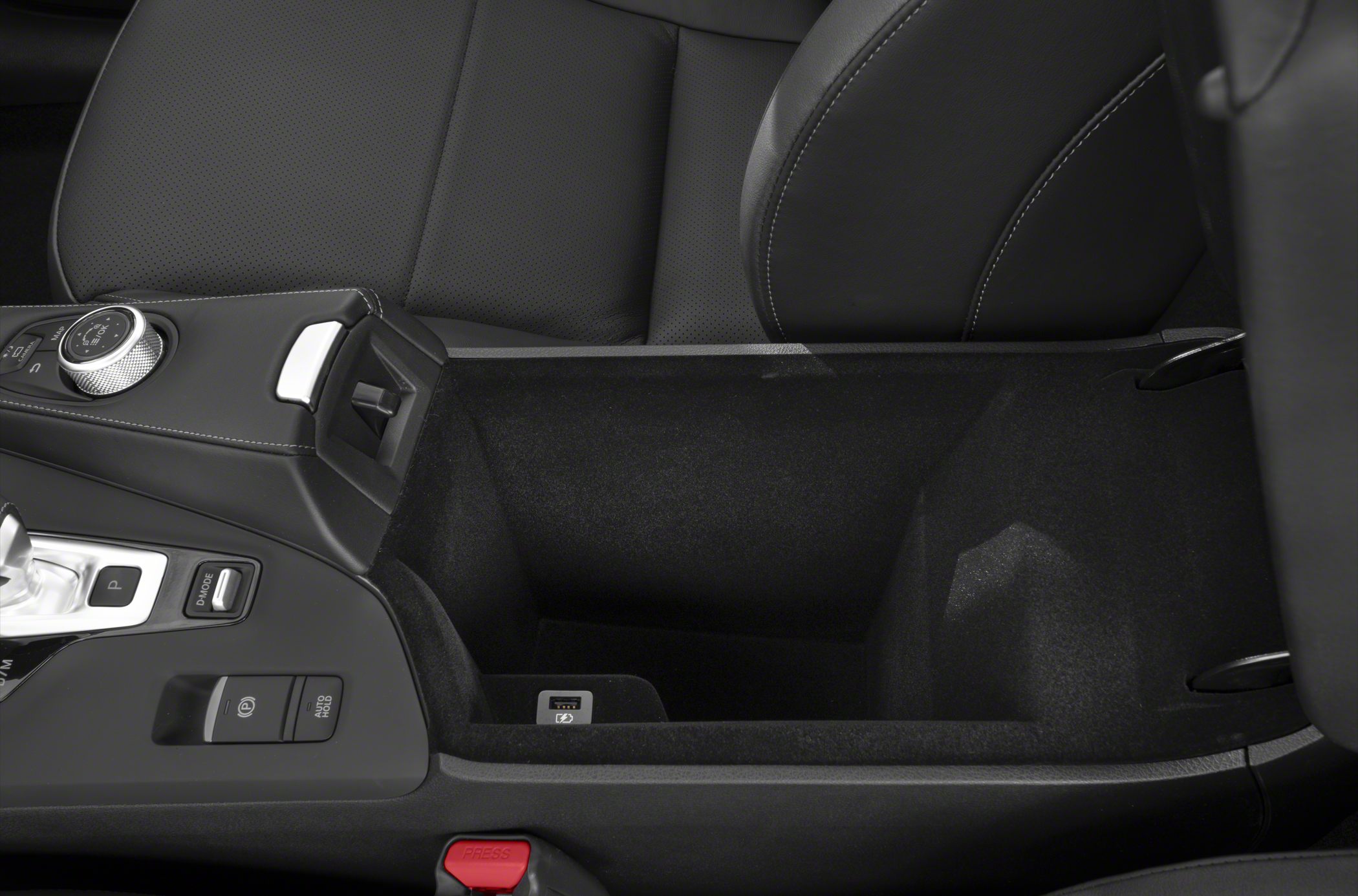 Center console storage with control dial, electronic parking brake, and USB port