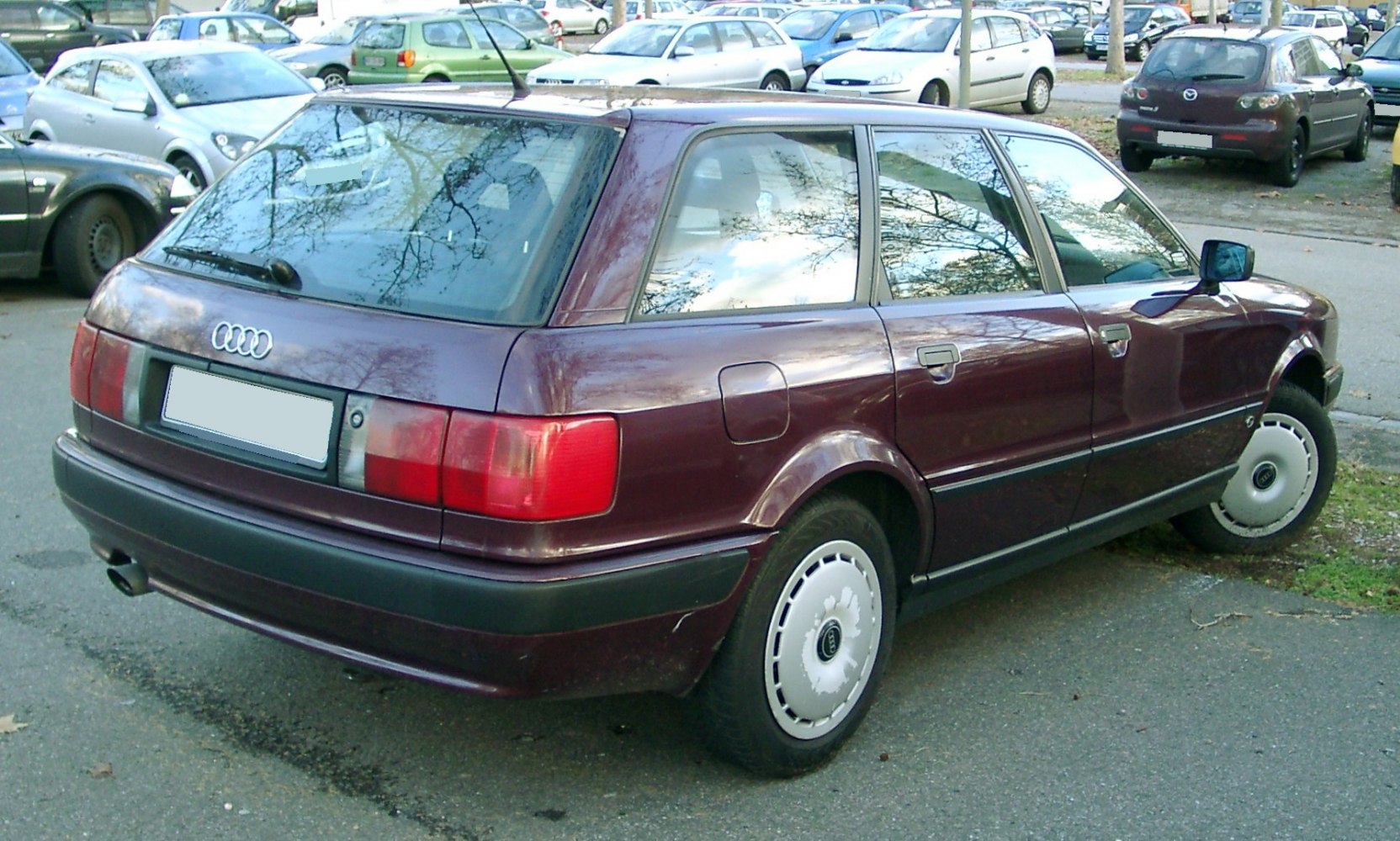 Rear side view of a classic estate vehicle with distinctive taillights and boxy design.