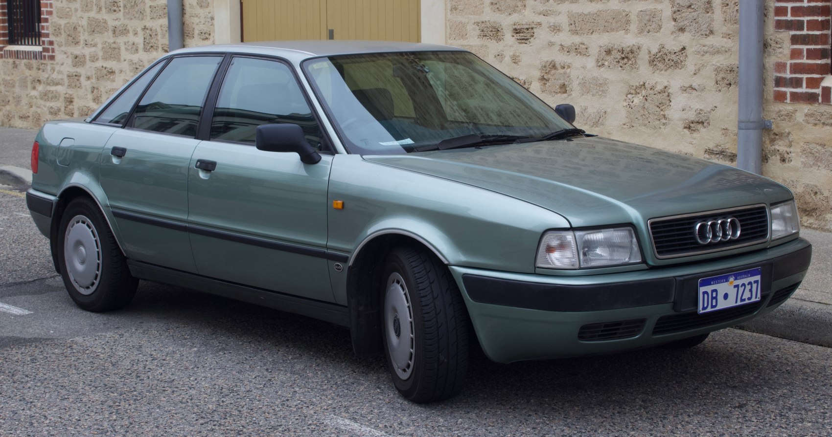 Classic front-side view of a 1990s four-door sedan