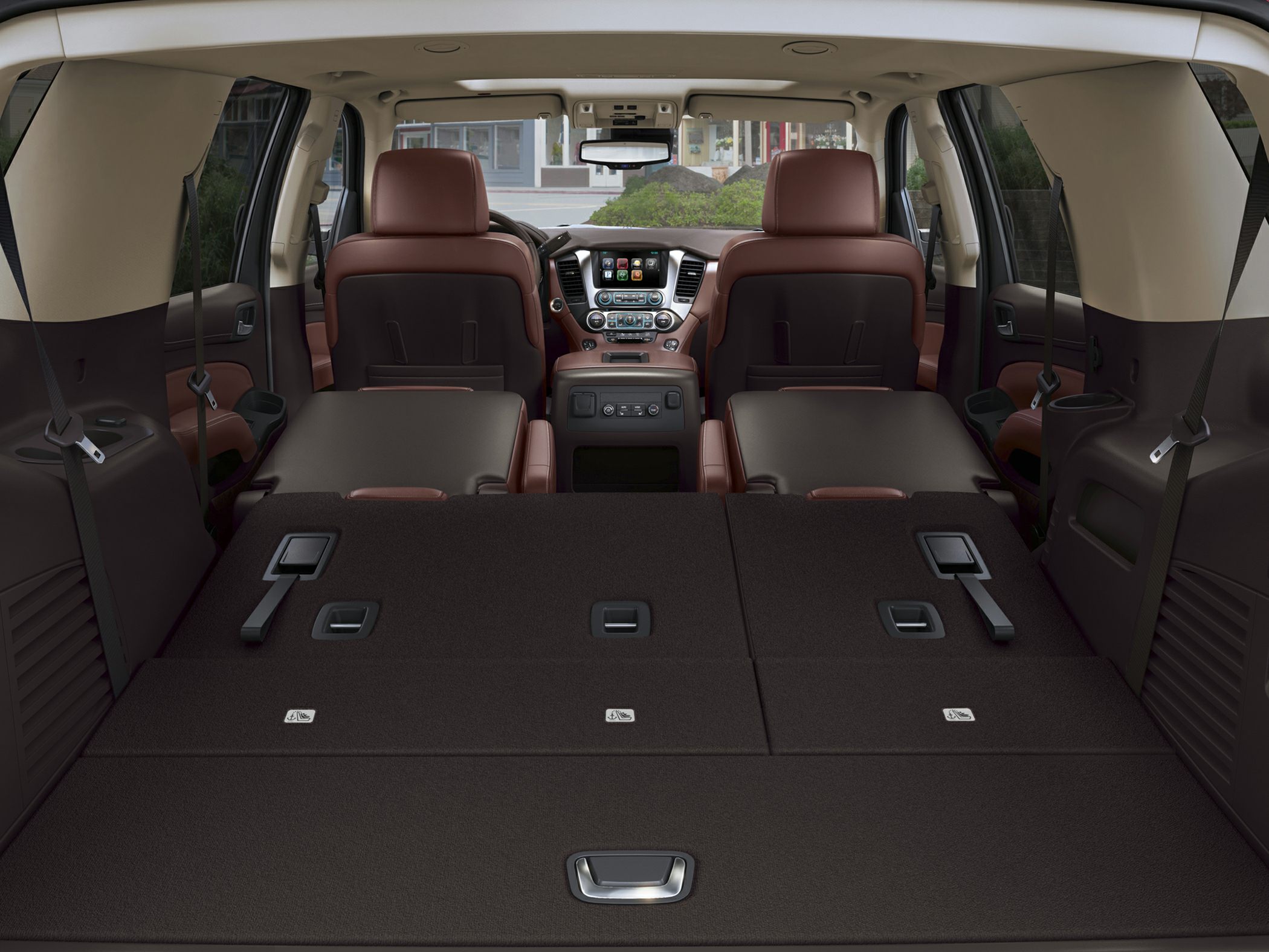 Spacious folded rear seats and cargo area with visible front seats and dashboard.