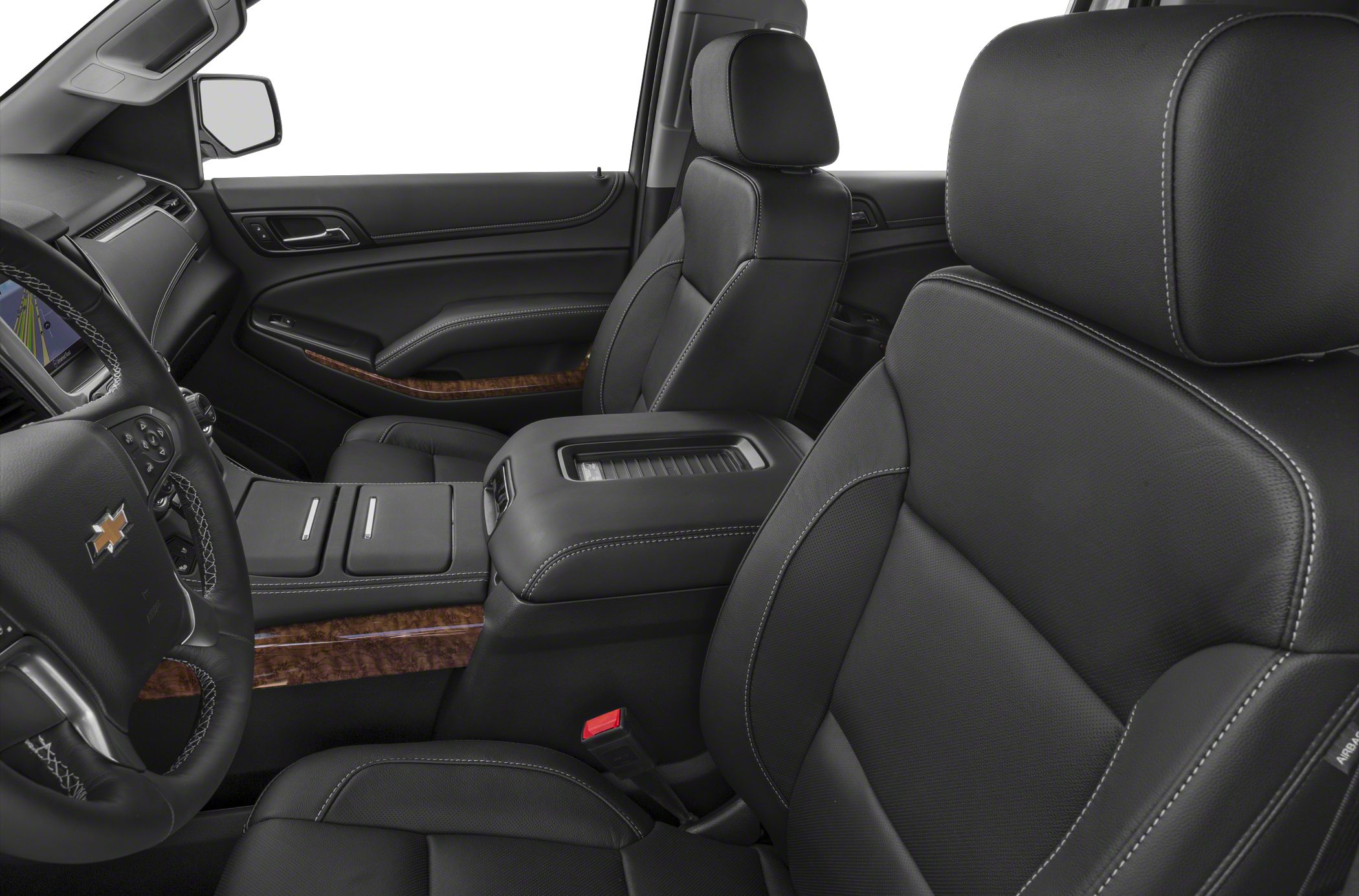 Black leather seats with white stitching and wood grain dashboard accents
