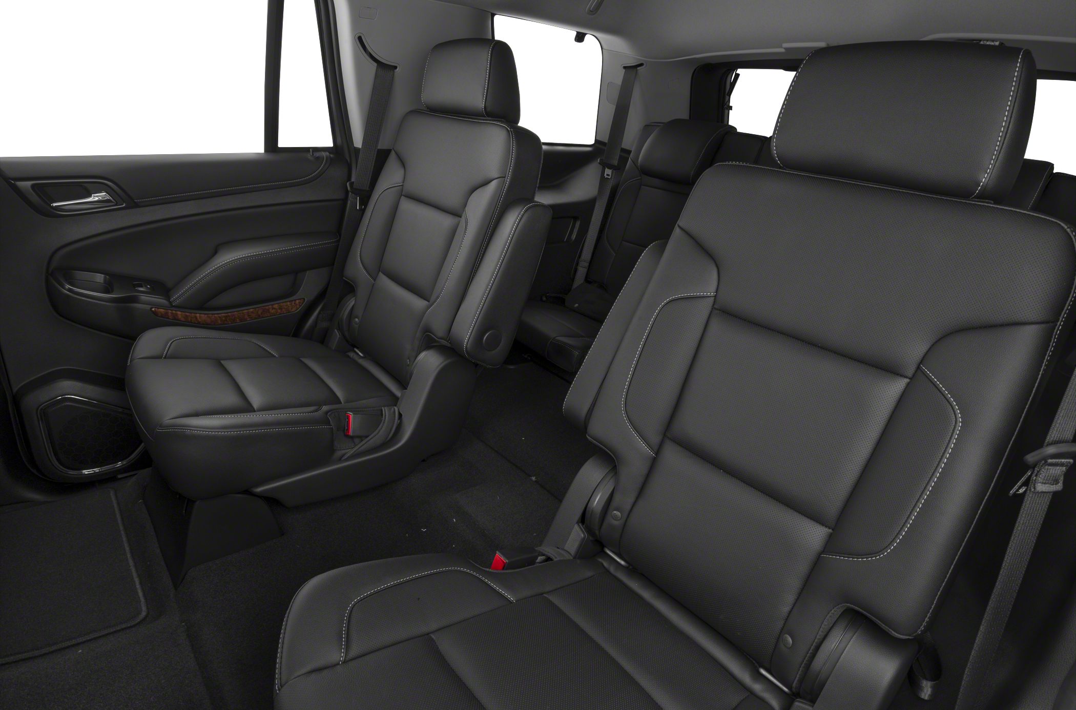 Black leather second-row captain seats with armrests and stitching