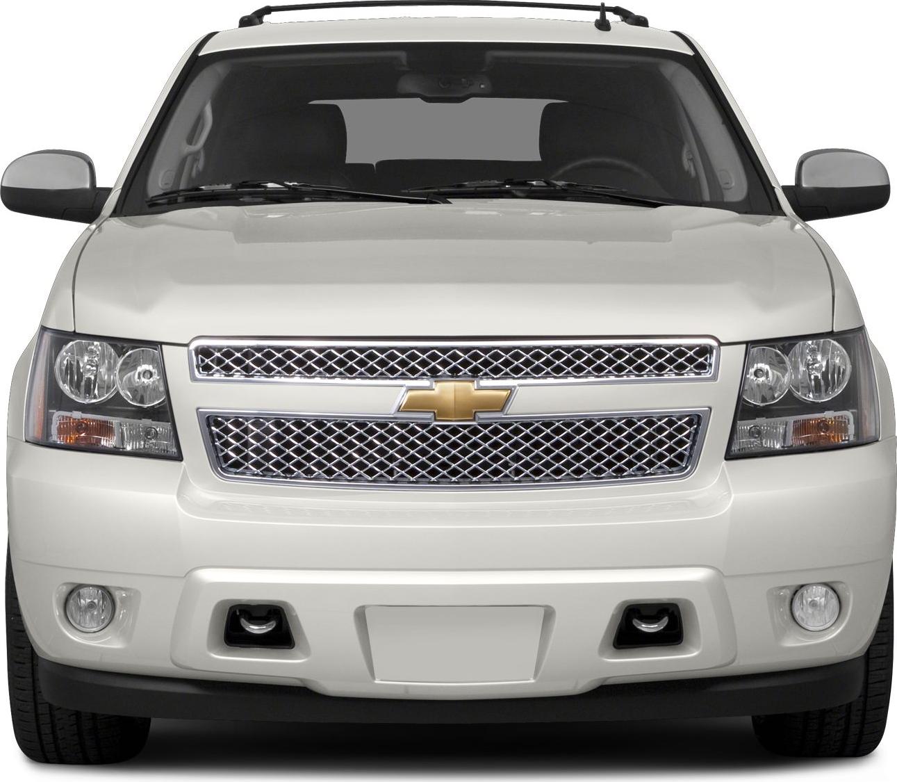 Large SUV front with chrome mesh grille and fog lights