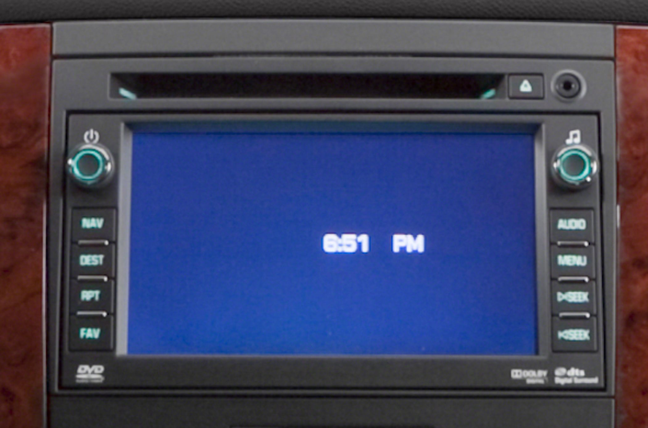 In-dash navigation and audio control system with digital display and DVD player.