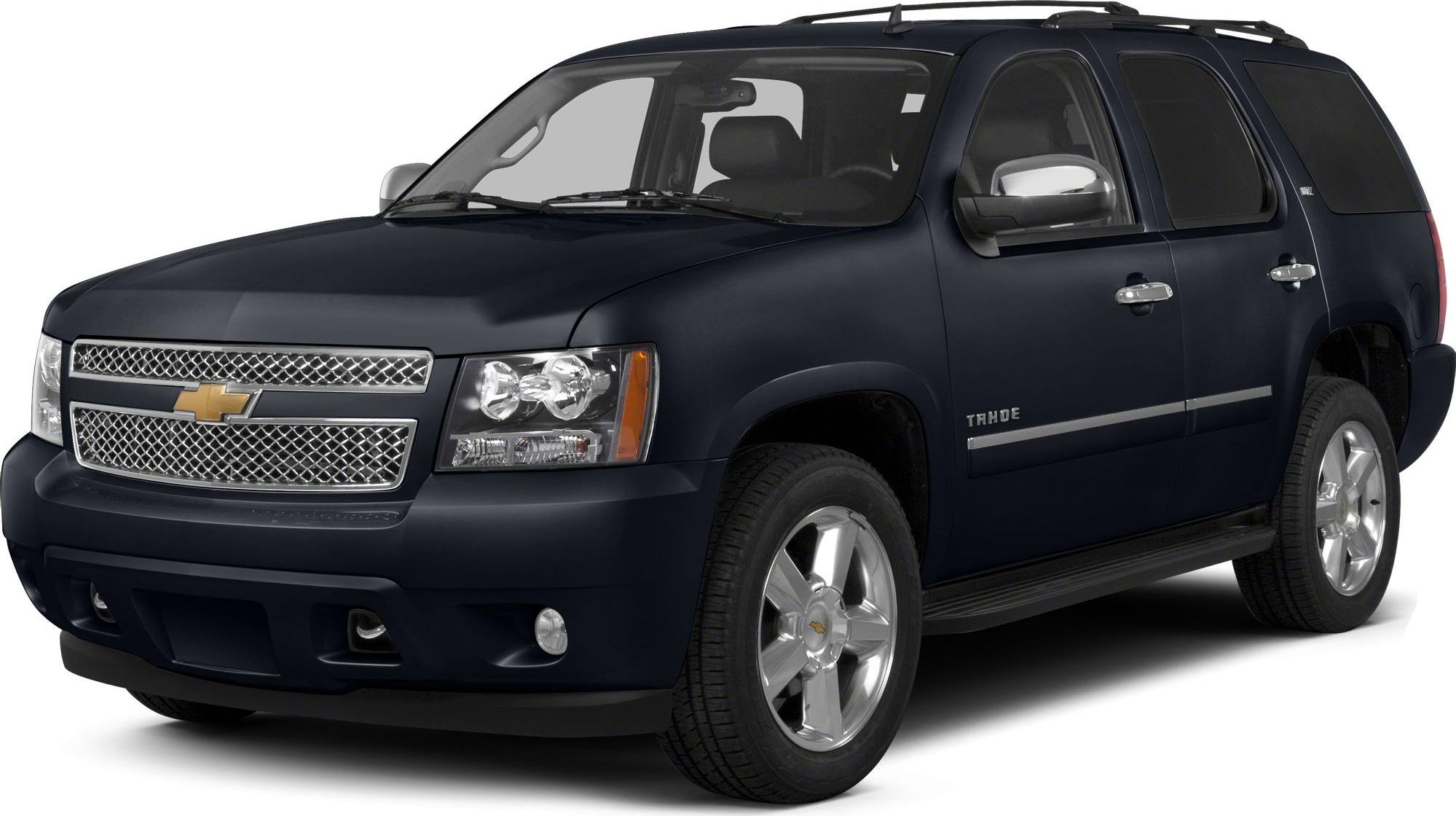 Front side view of SUV with detailed grille and headlamps