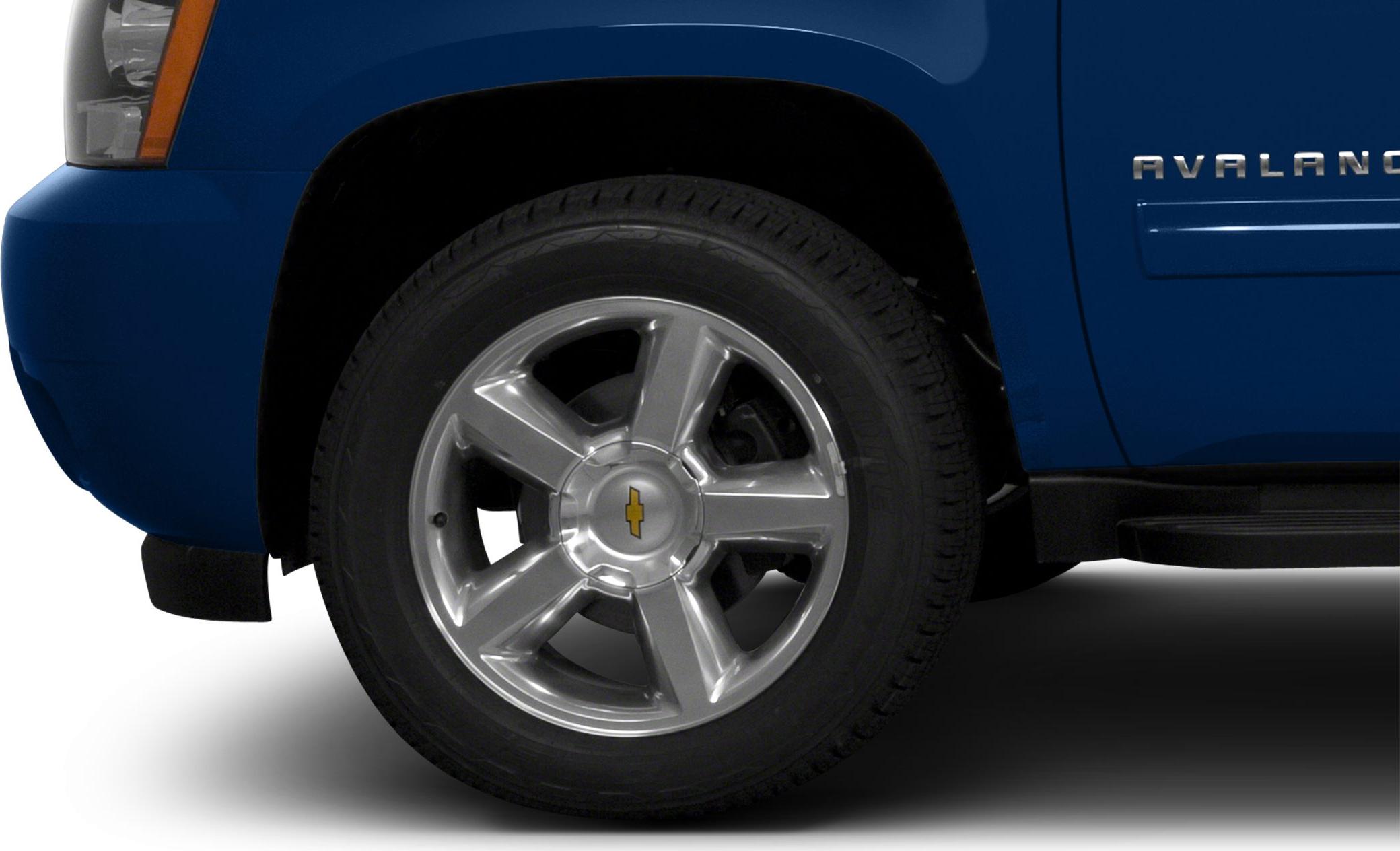 Front alloy wheel and fender of a mid-2000s truck