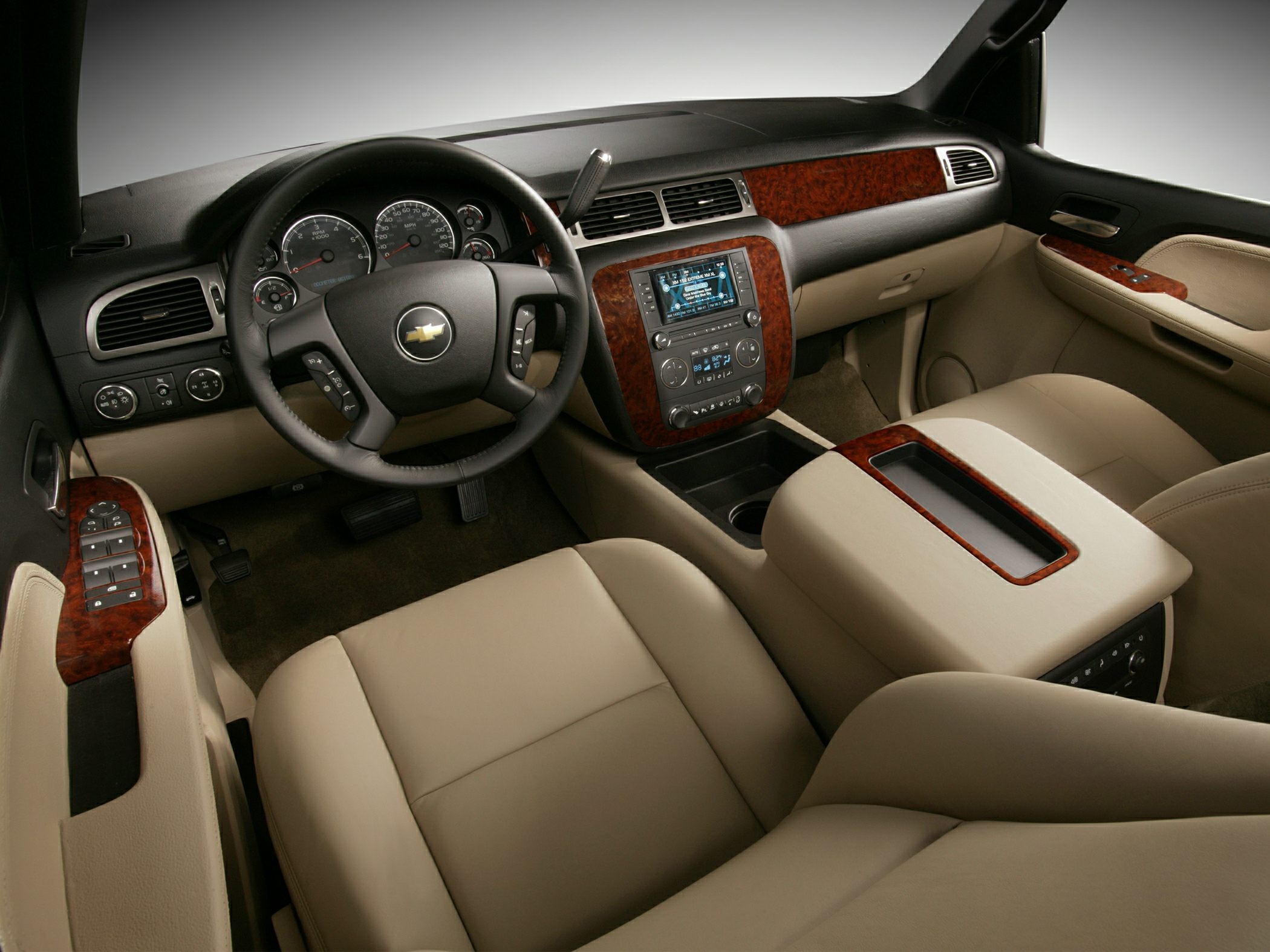 Beige interior with wood trim and advanced dashboard controls