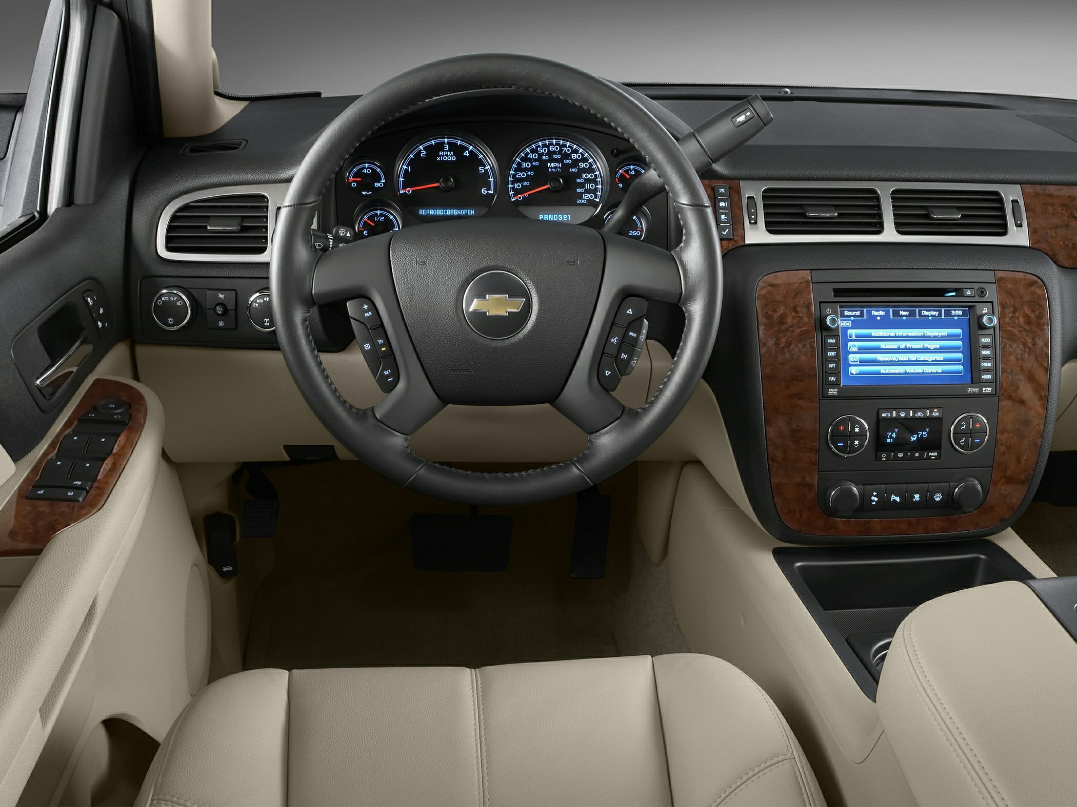 Interior dashboard with steering wheel, digital gauges, and infotainment screen