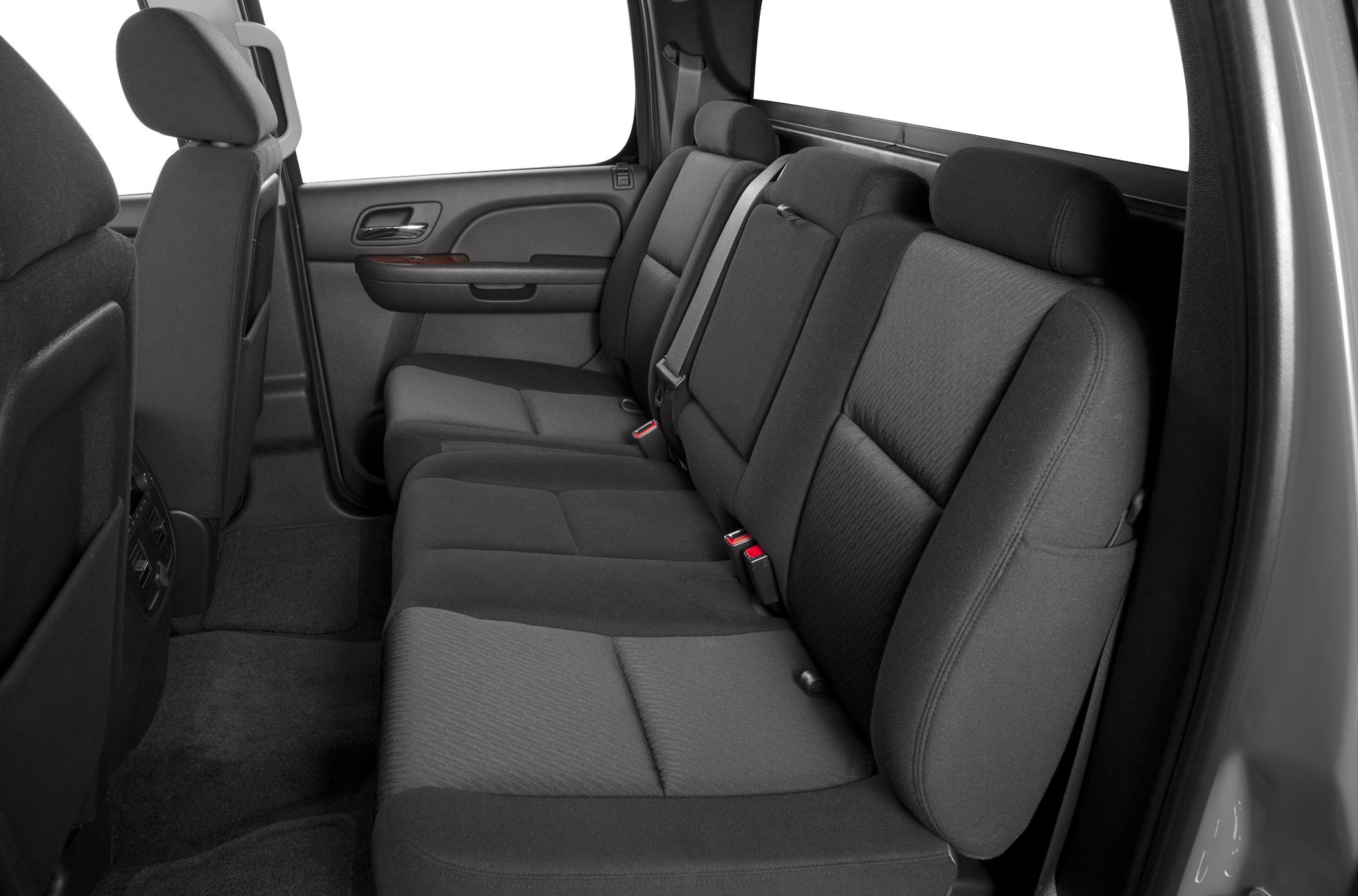 Spacious rear seating with dark upholstery and headrests in vehicle interior