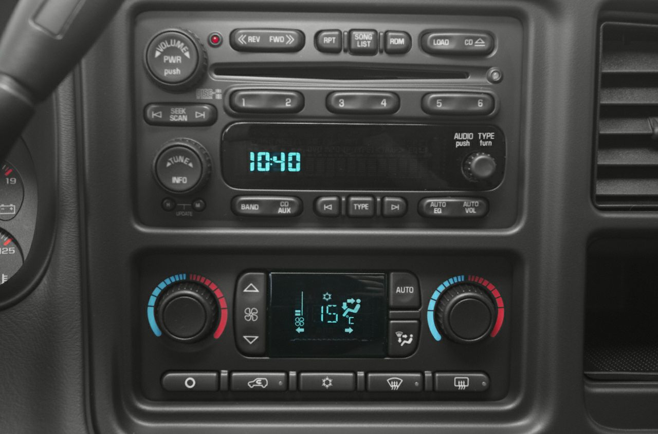 Dashboard radio and digital climate control panel with knobs and display