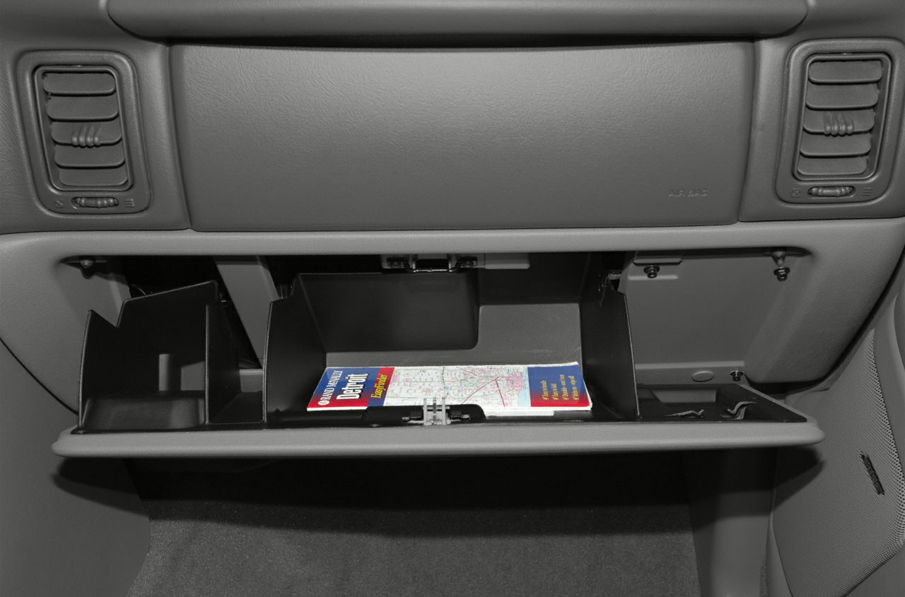 Open glove compartment with organized storage in car interior