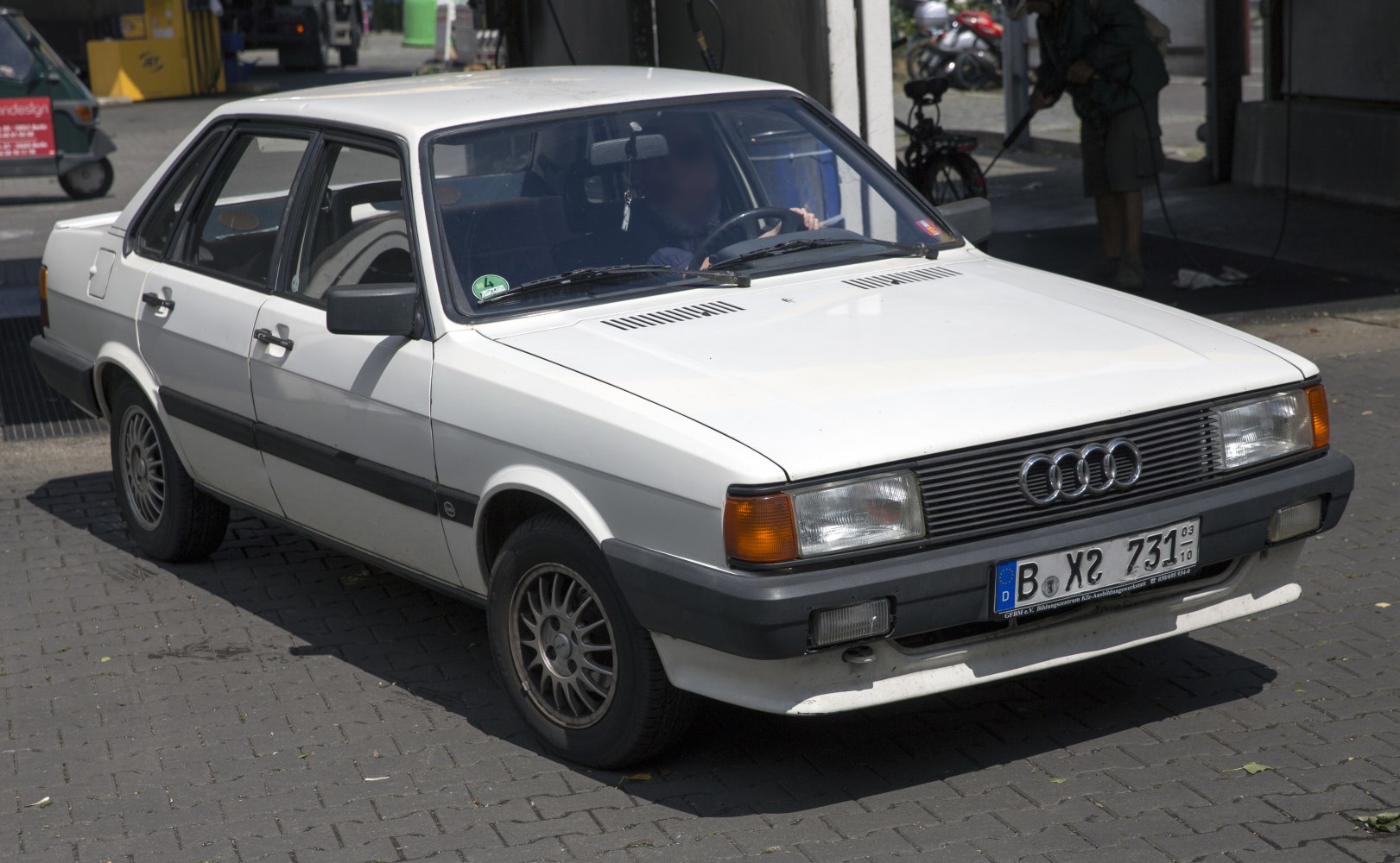 Classic sedan with rectangular headlights and front three-quarter view.