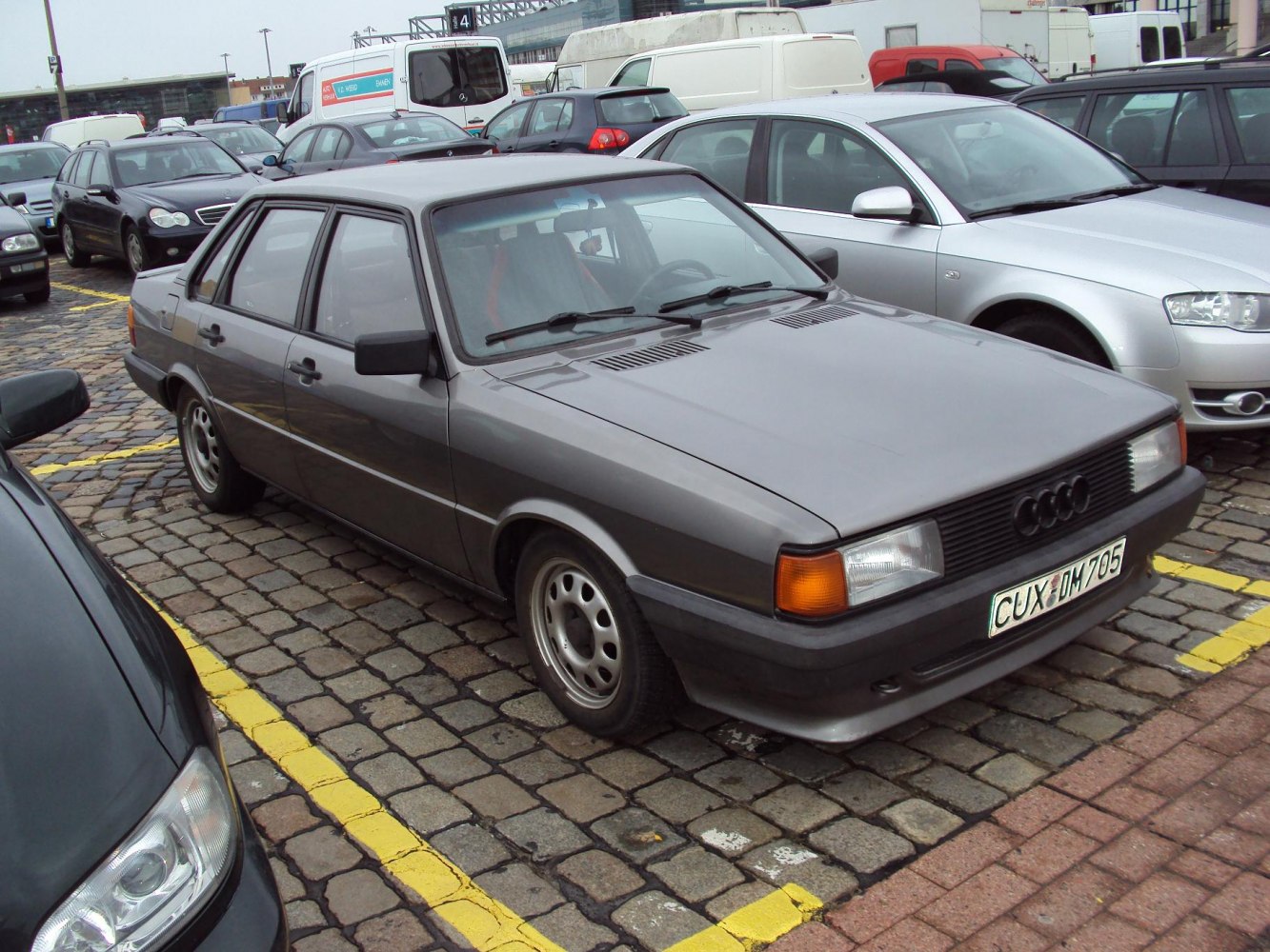 Classic 1980s sedan with rectangular headlights and black grille