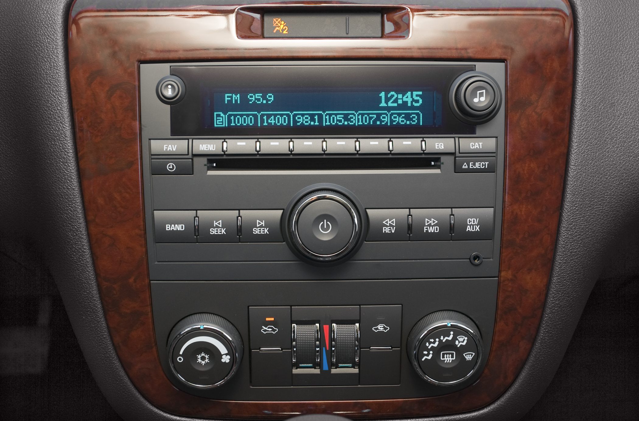 AM/FM radio, CD player, manual climate controls, woodgrain trim