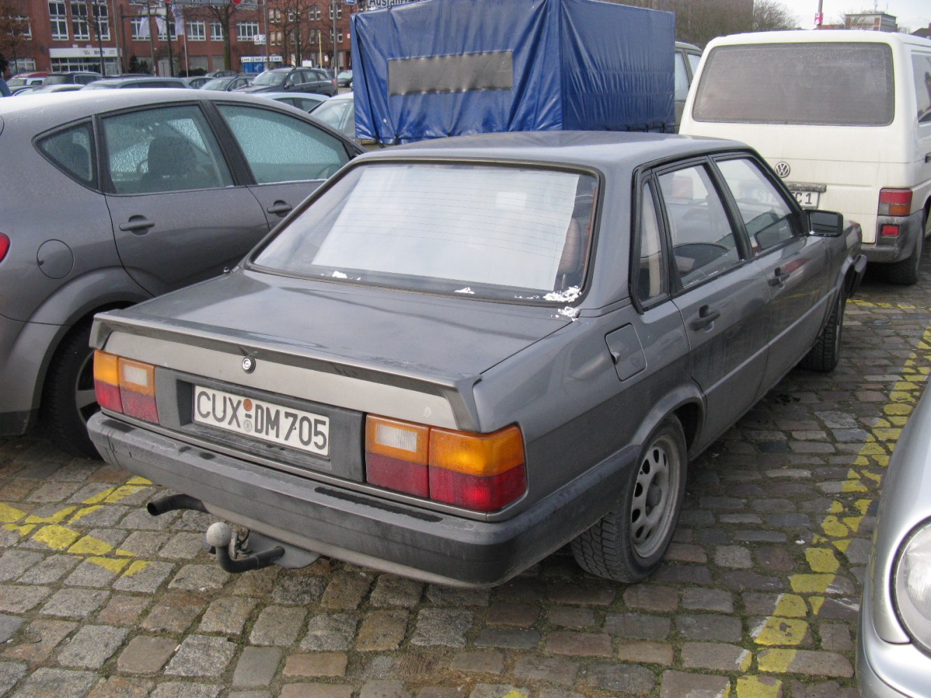 Rear view showing classic taillights and squared trunk design