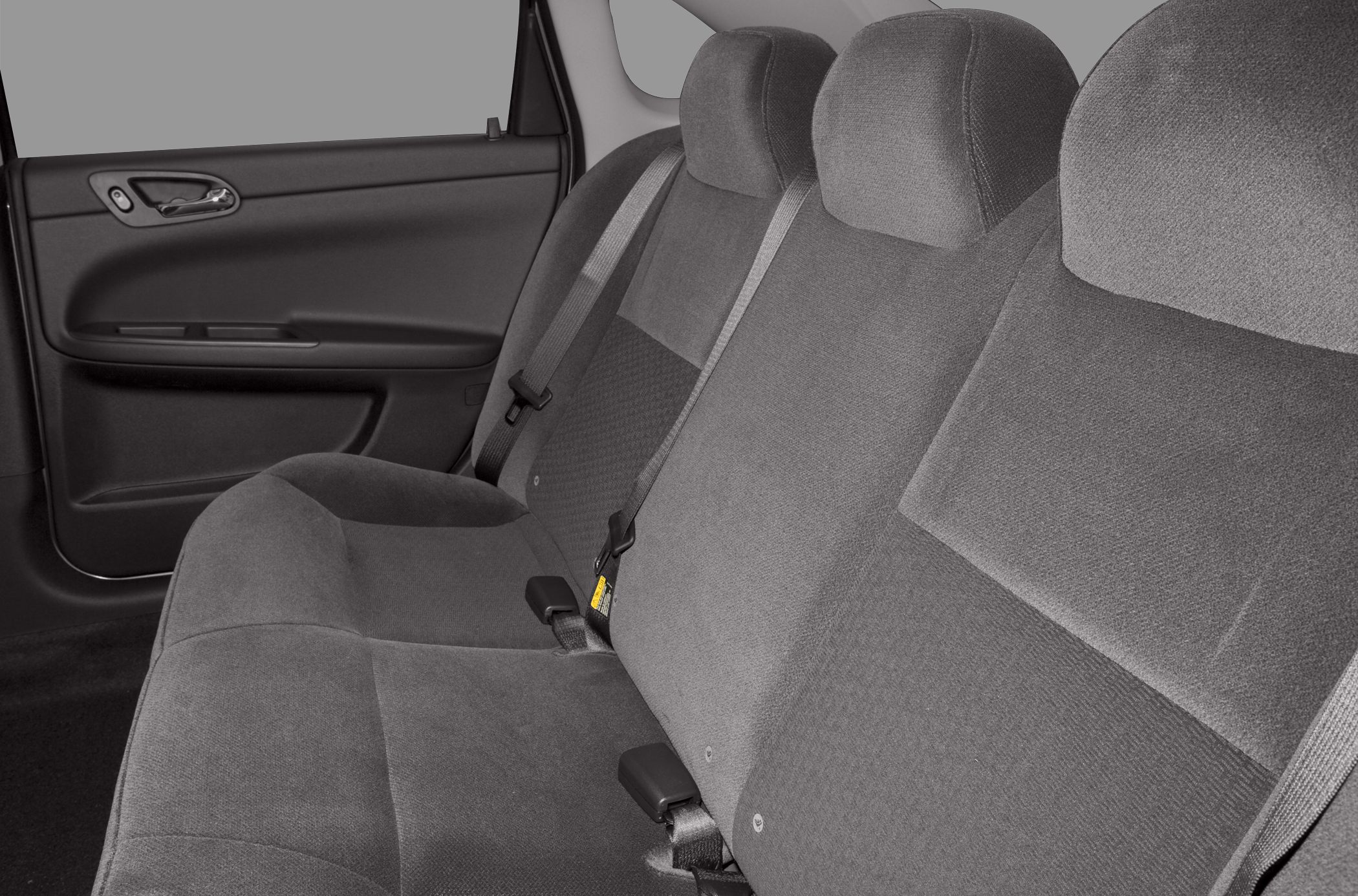 Fabric rear seat upholstery and seatbelt with door panel