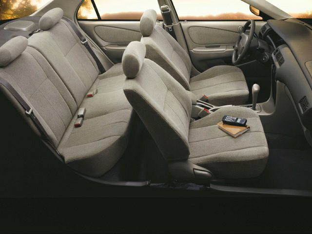 Cloth seats interior with front and rear seating and manual transmission gearshift