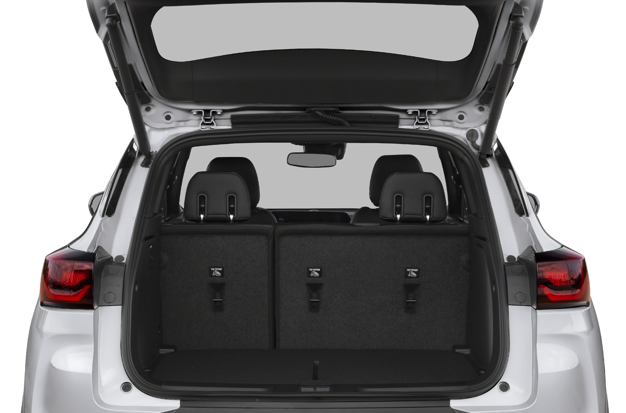 Open rear cargo space with folded seats and modern tail lights