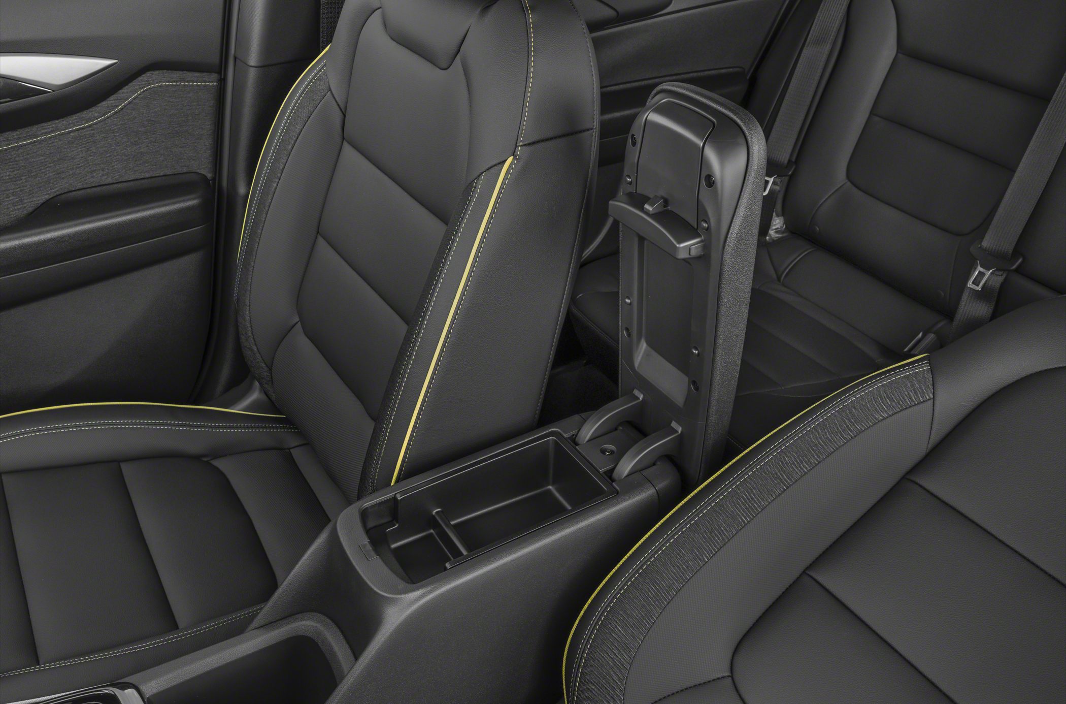 Black seats with yellow stitching and center console storage
