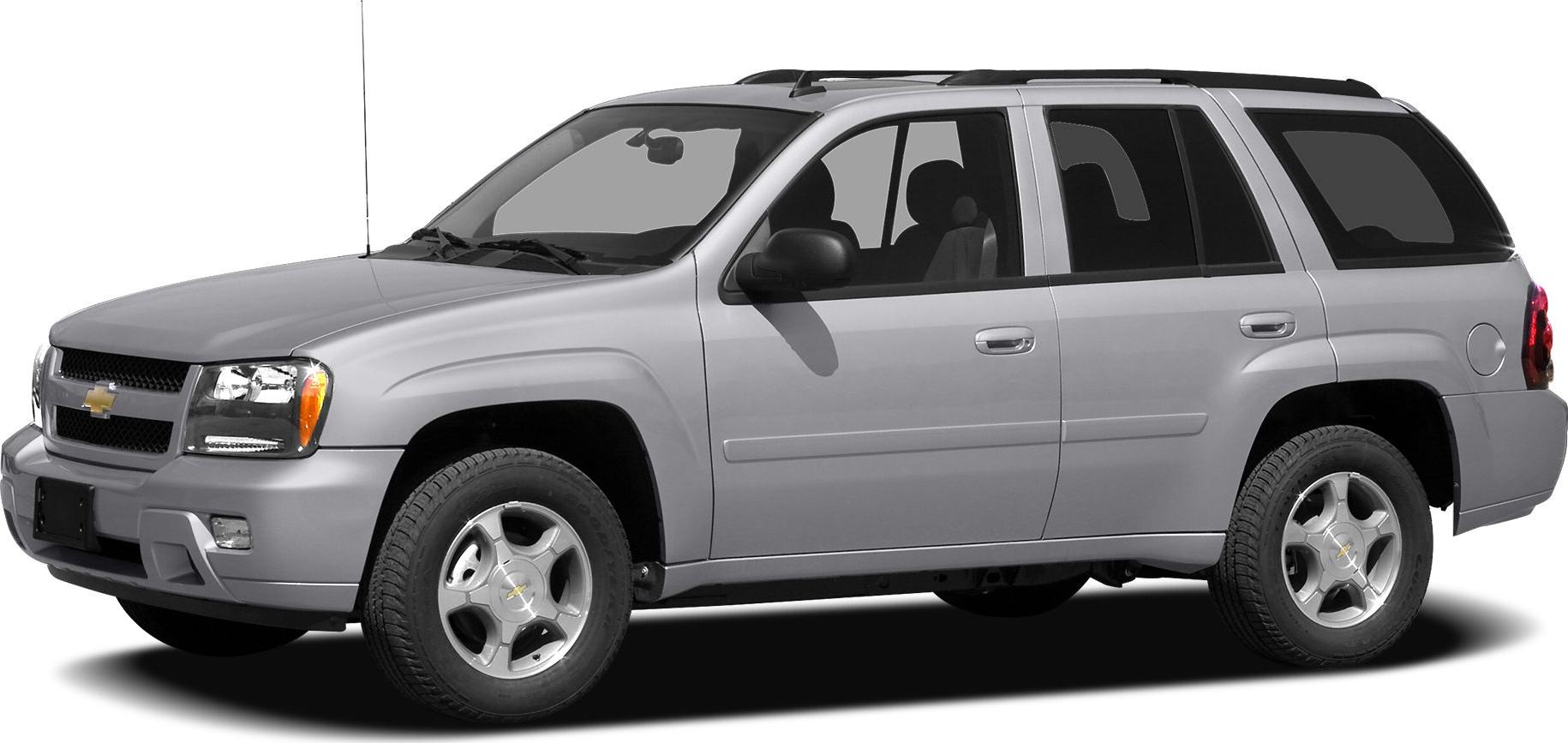 Side profile of mid-size SUV with roof rails and silver finish