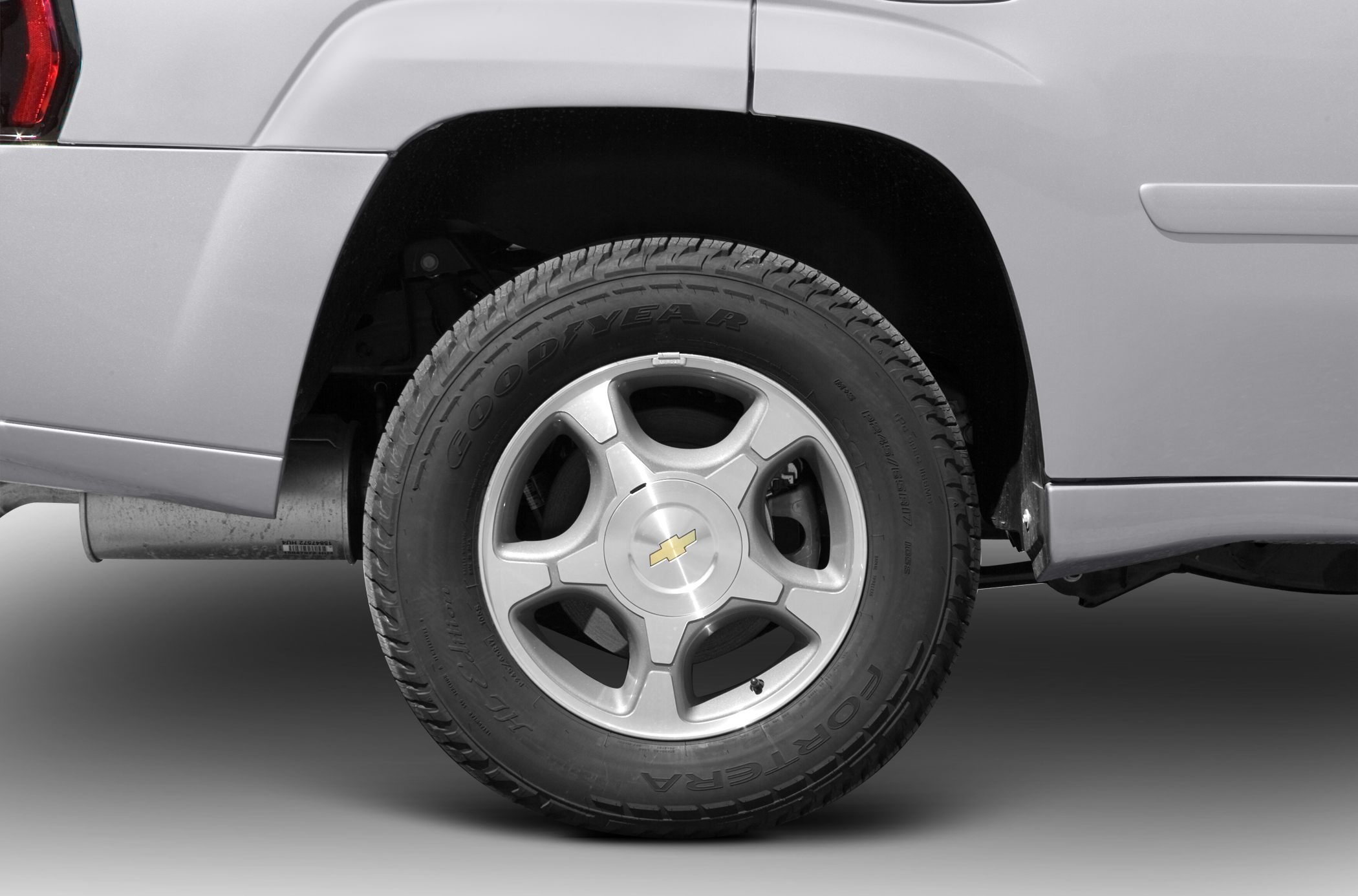 Close-up of rear wheel with alloy rim and Goodyear tire