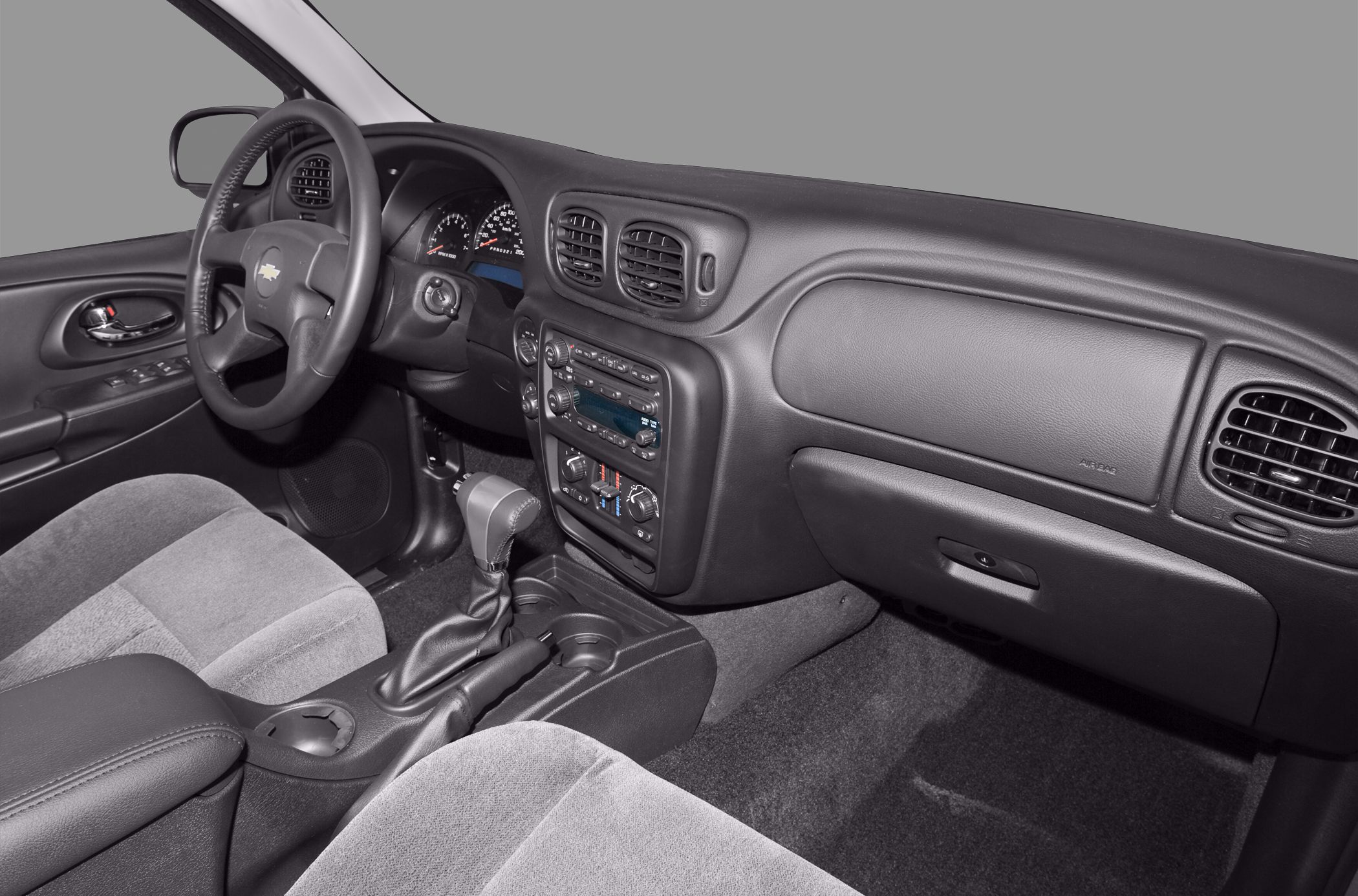 Dashboard, steering wheel, and center console with gear shifter