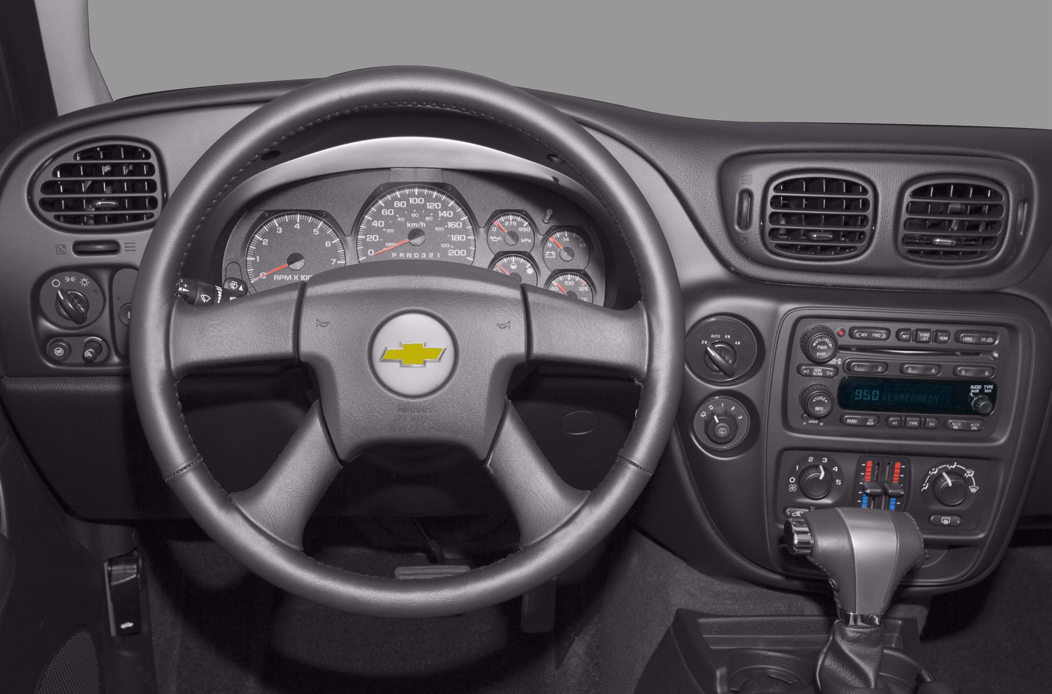 Steering wheel with instrument cluster and center console controls