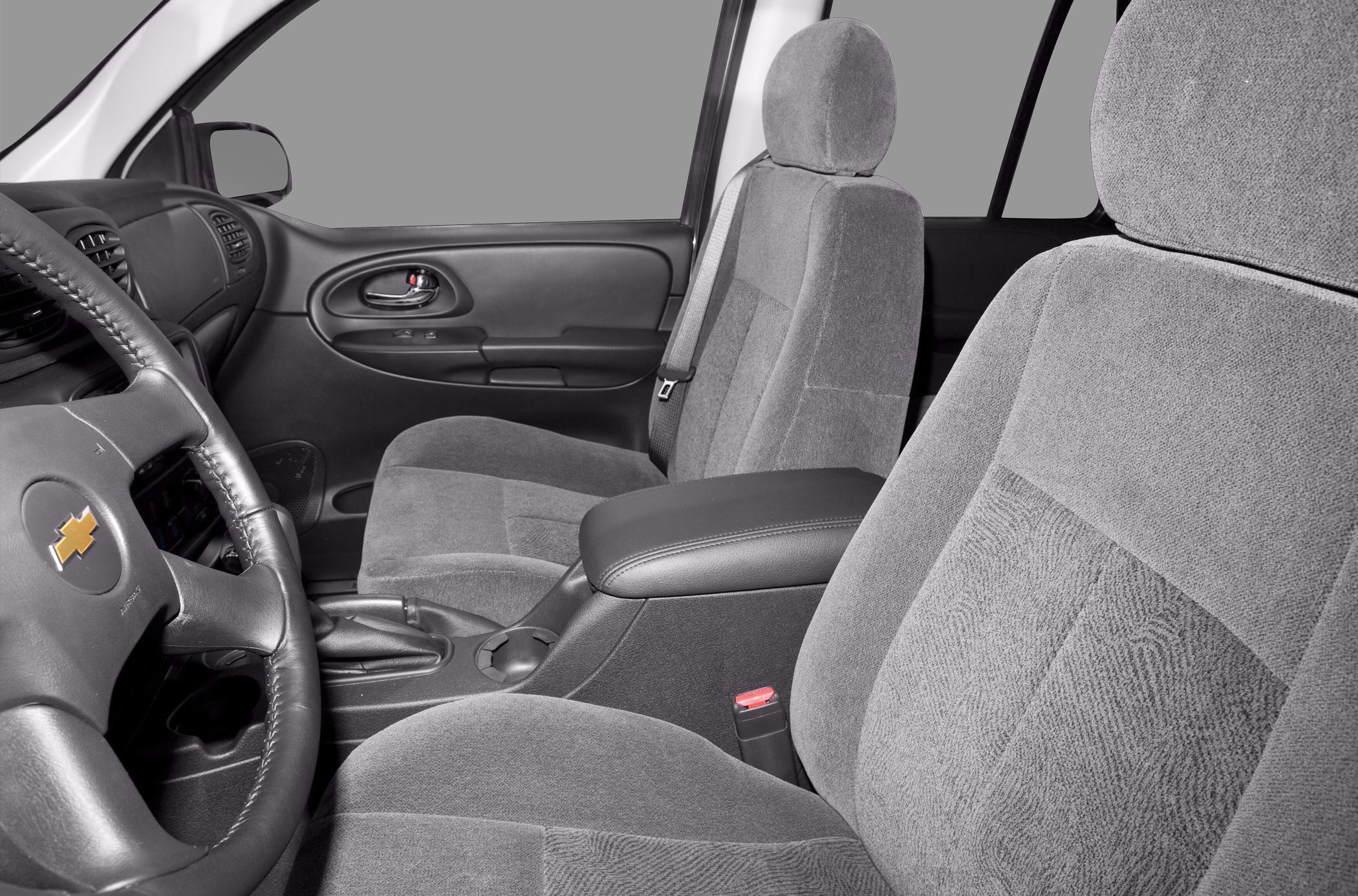 Gray fabric seats with leather armrest and detailed steering wheel
