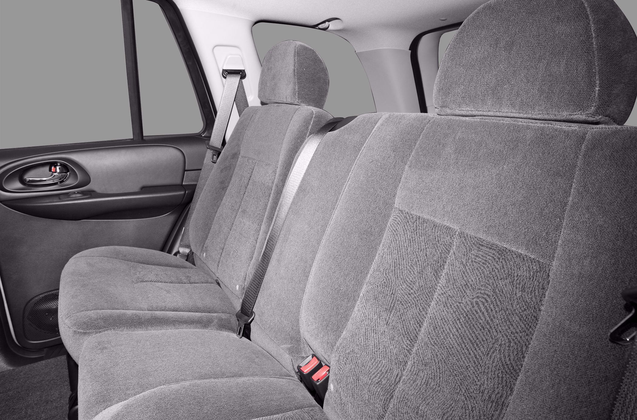 Rear seat upholstery with headrests and seat belts