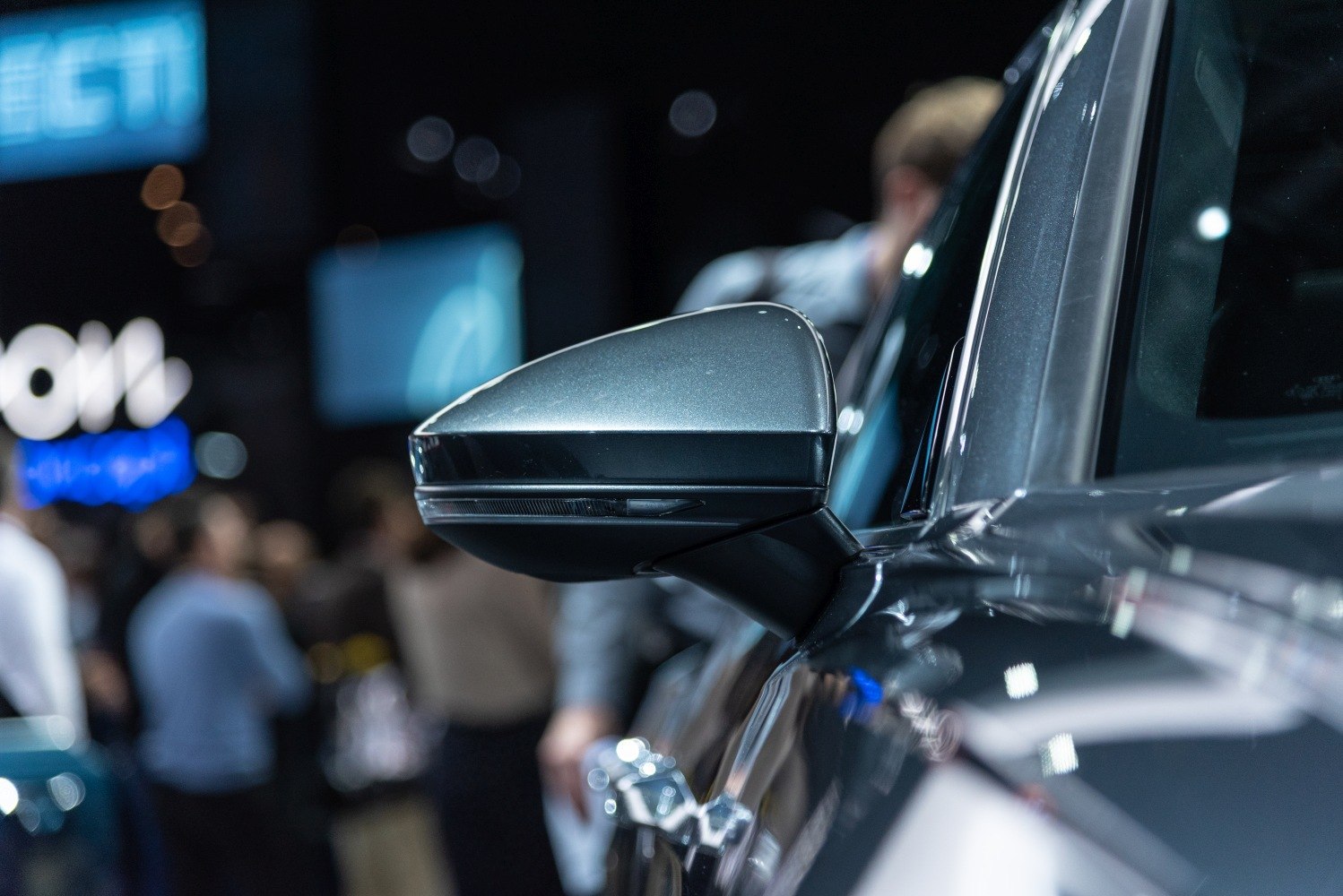 Close-up of sleek side mirror with integrated turn signal