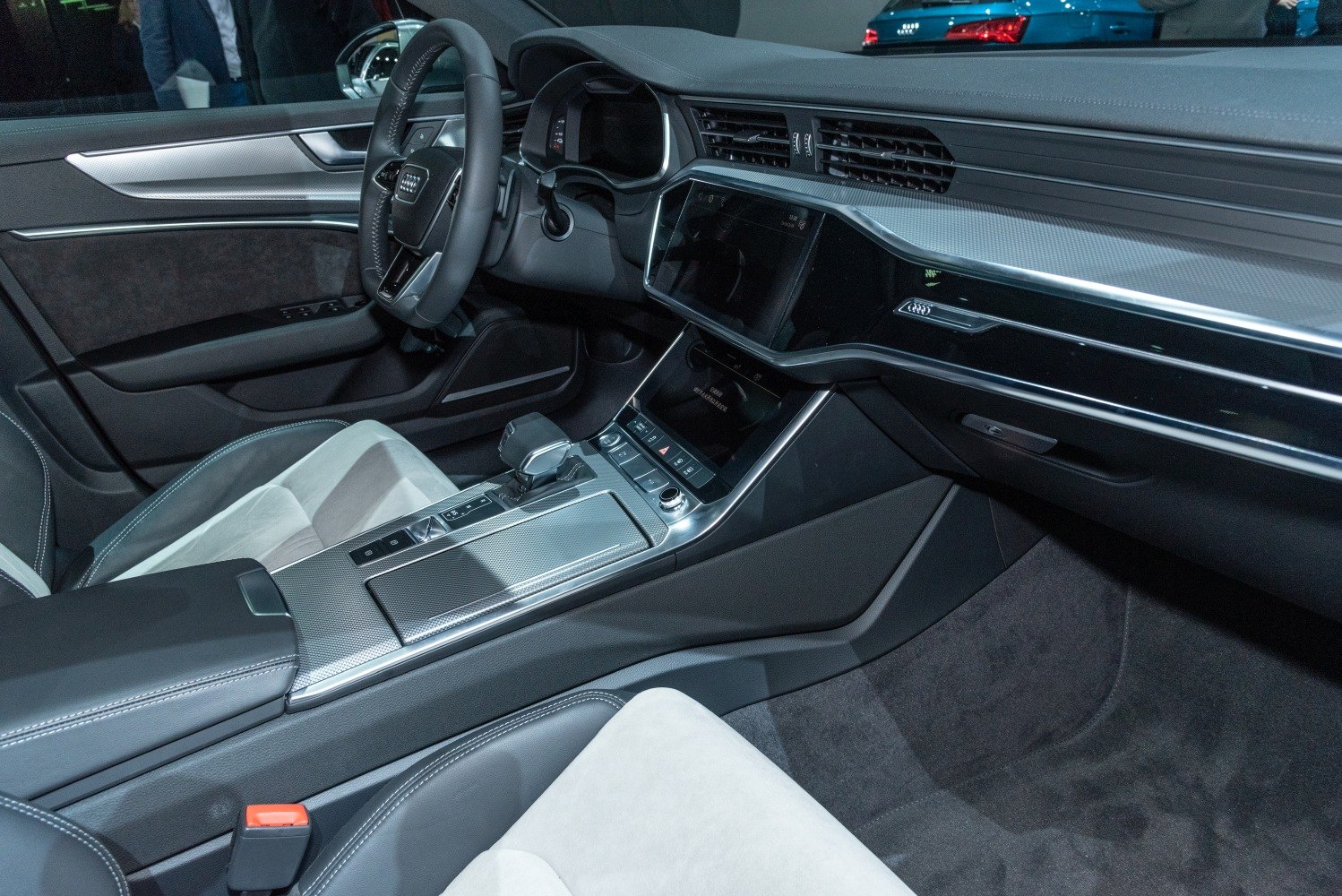 Modern dashboard and center console with digital displays and premium finishes.