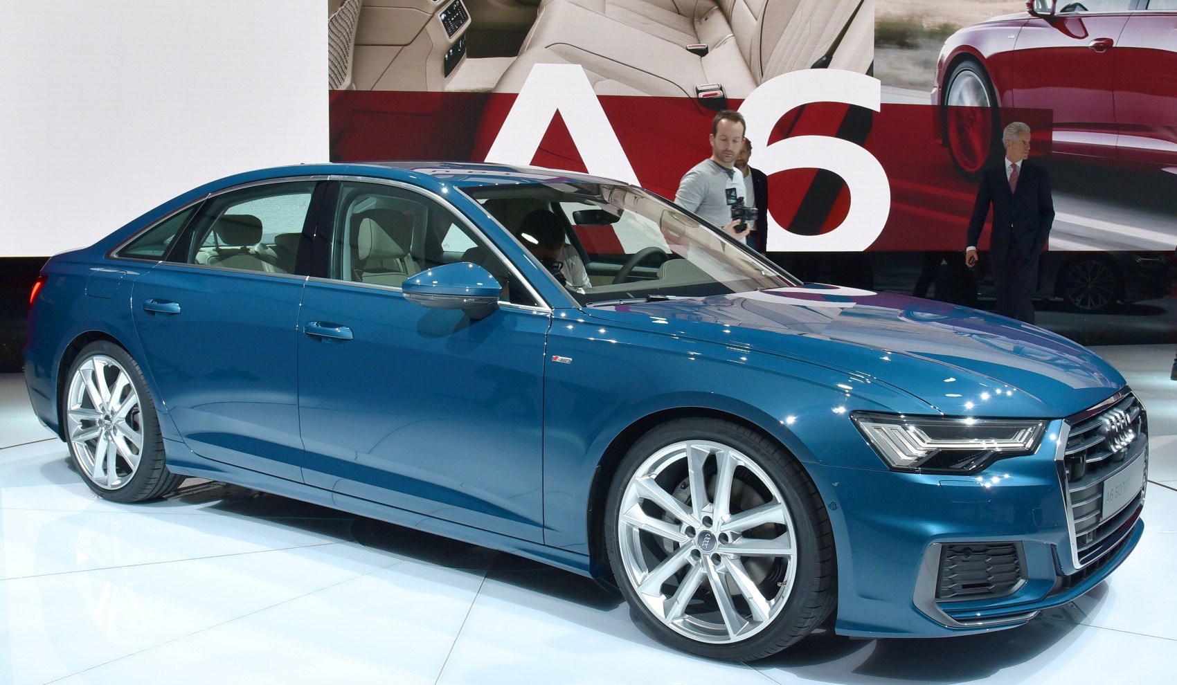 Blue luxury sedan with LED headlights and sporty alloy wheels