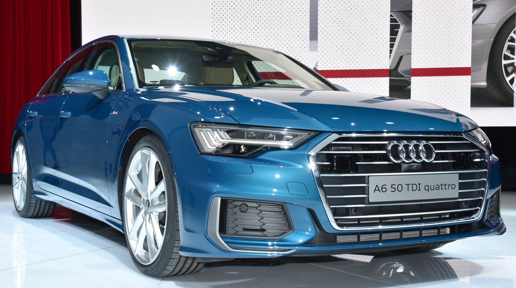 Front view with LED headlights and large grille