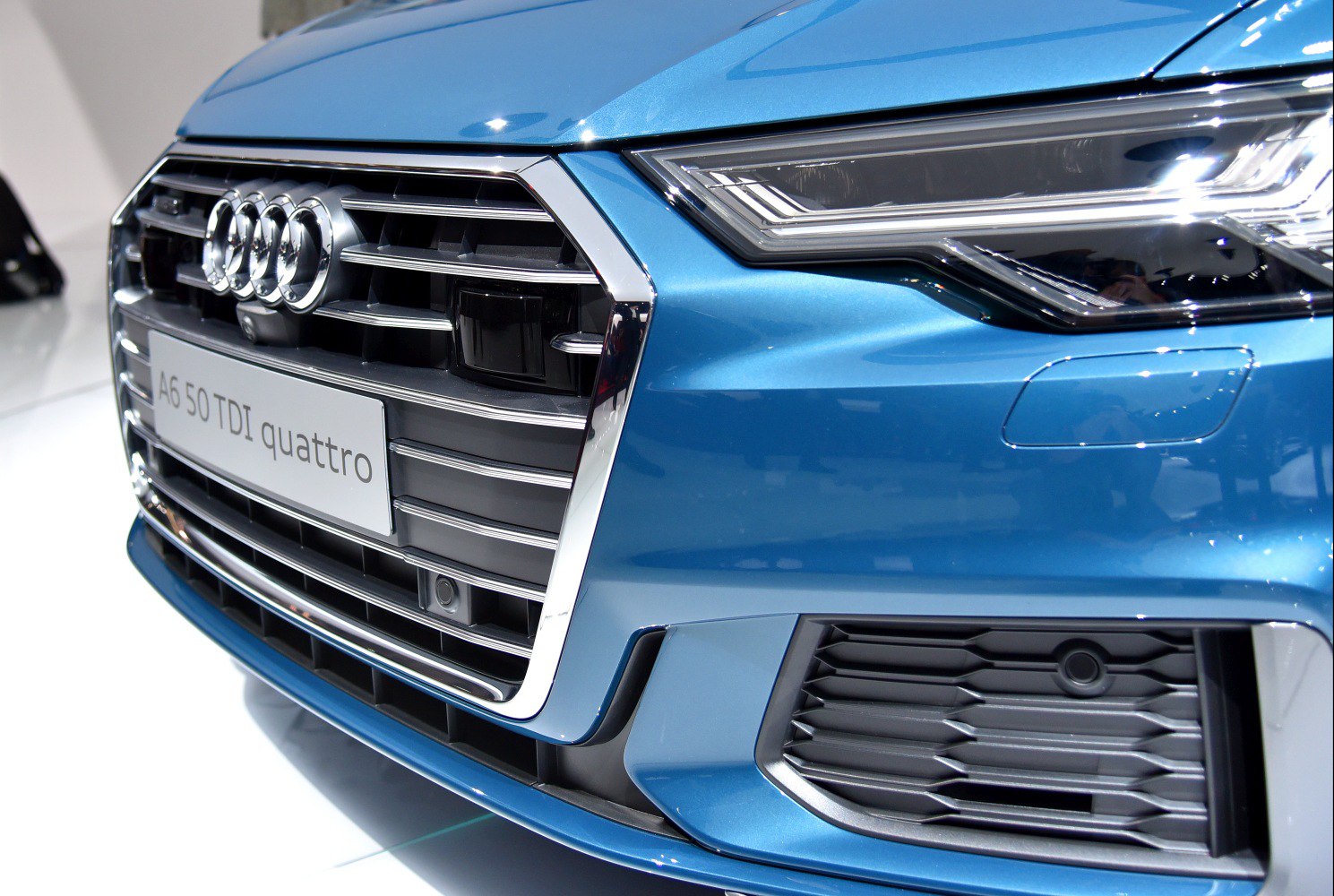 Close-up of front grille and LED headlight