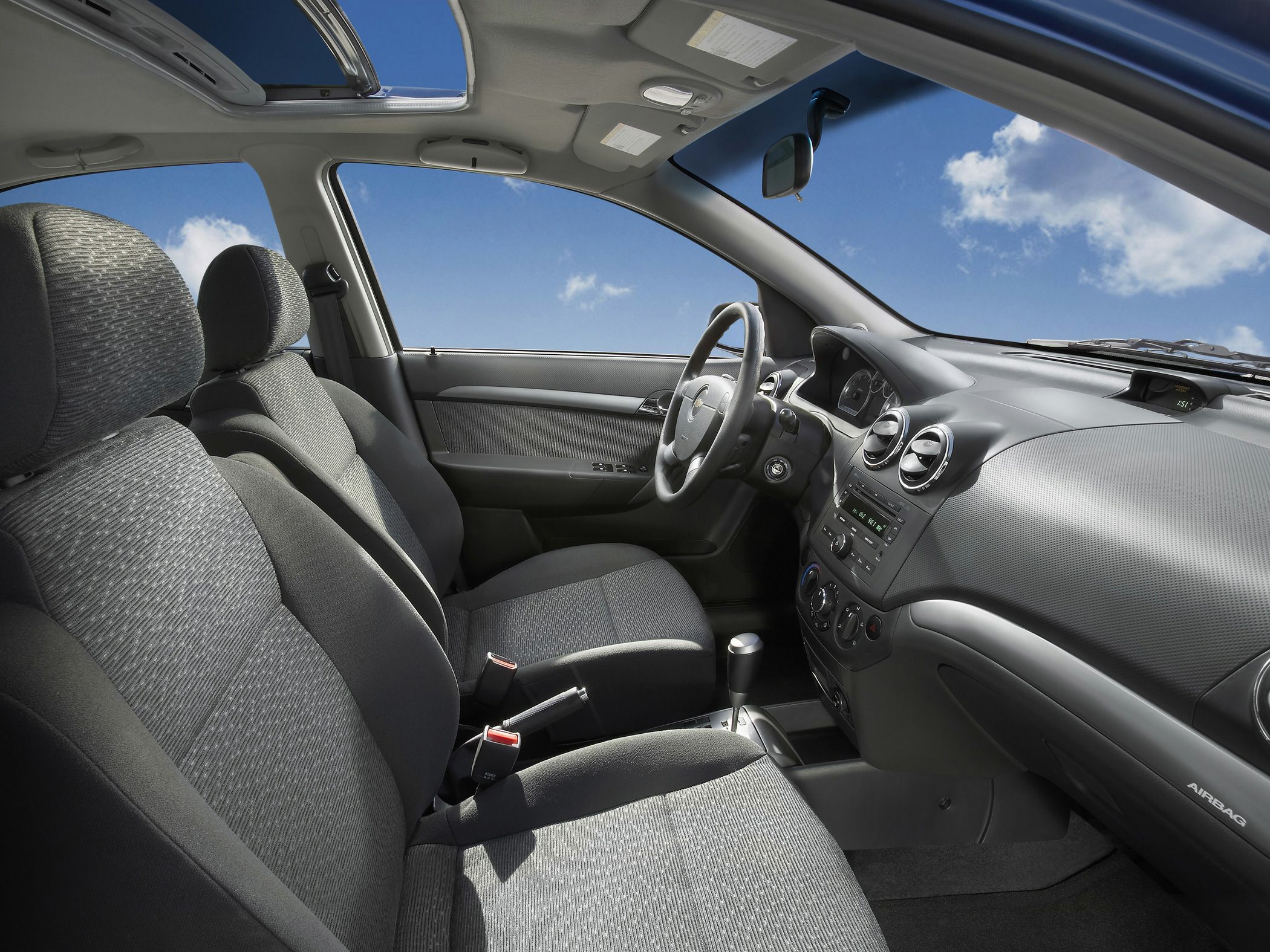 Fabric seats, modern dashboard, sunroof view