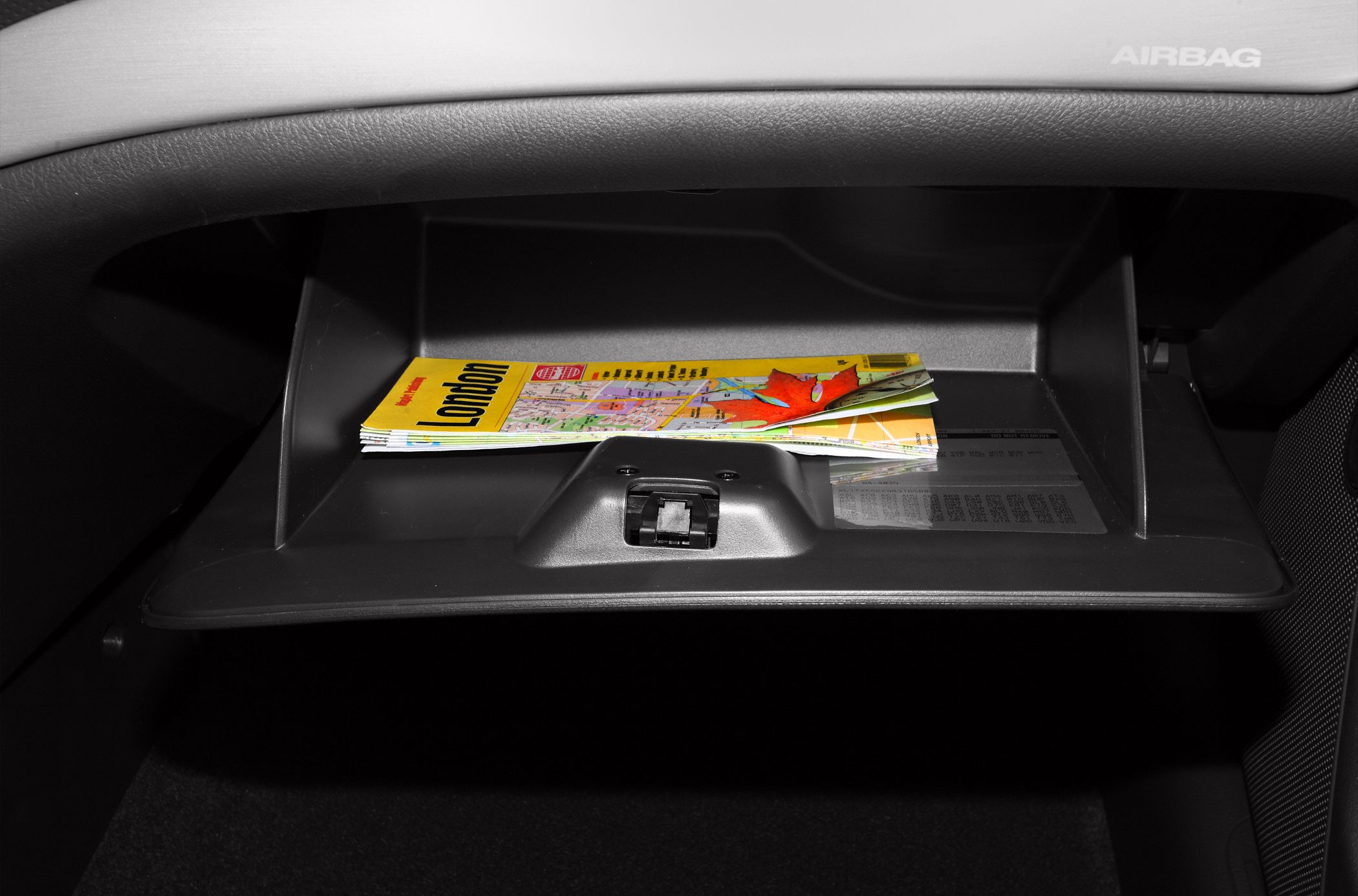 Glove box interior with city map inside