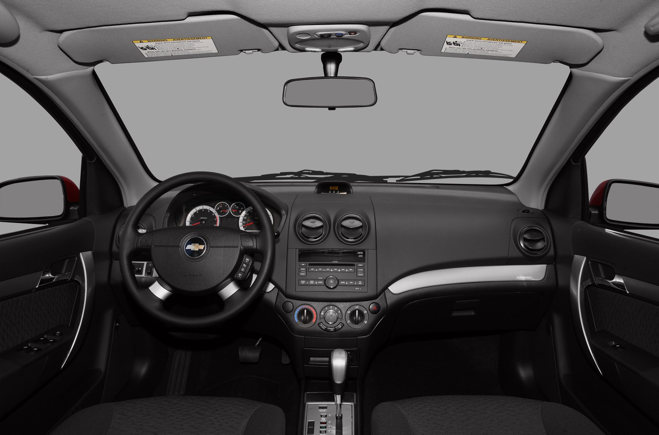 Dashboard with steering wheel, climate controls, and radio