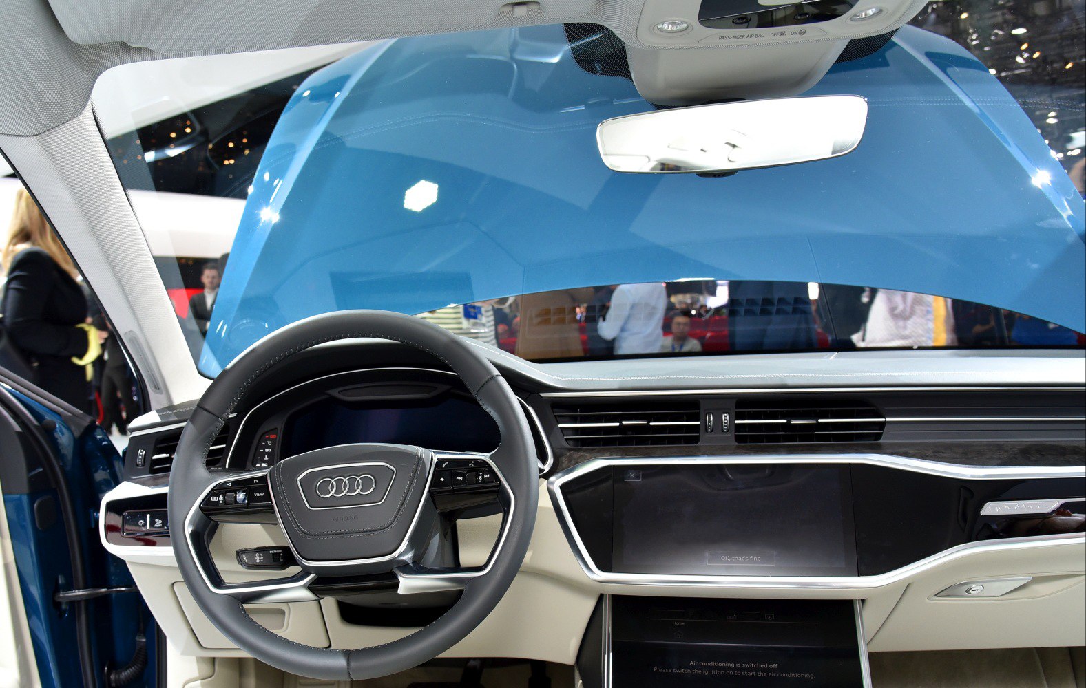 Modern steering wheel and digital dashboard with touchscreen controls