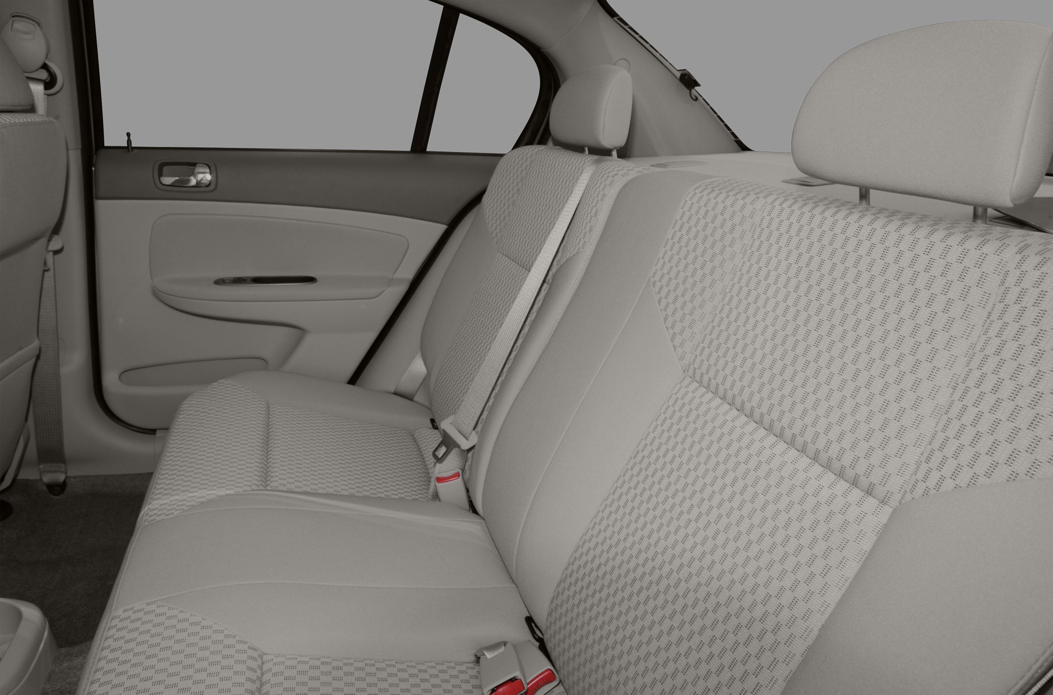 Rear seat upholstery with textured fabric and seatbelt