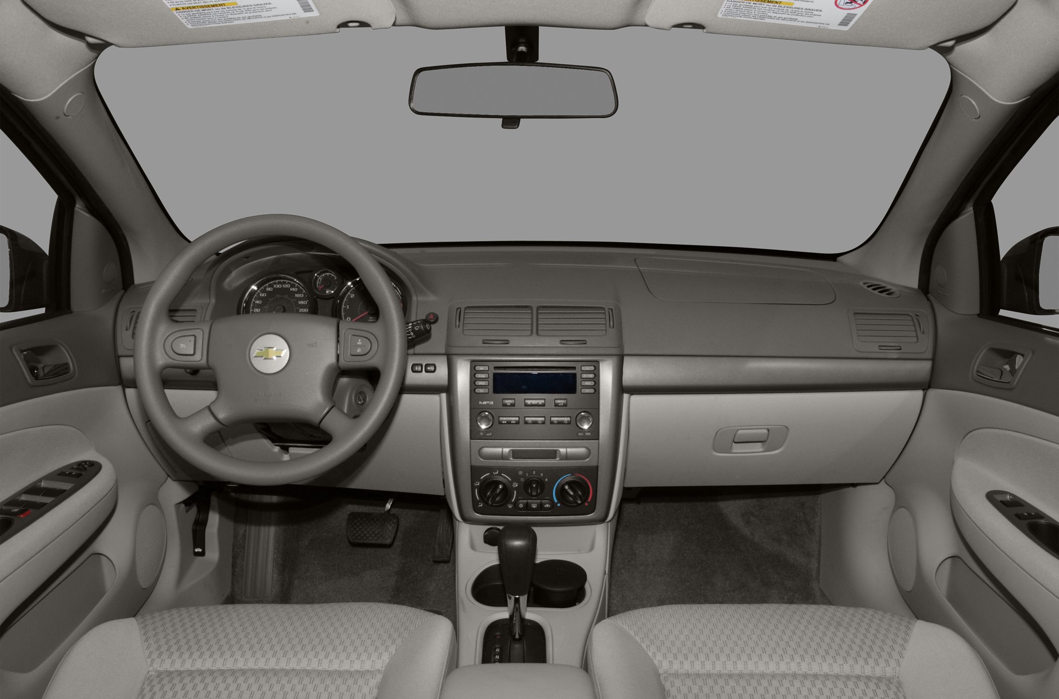 Interior view with steering wheel, dashboard, and center console controls