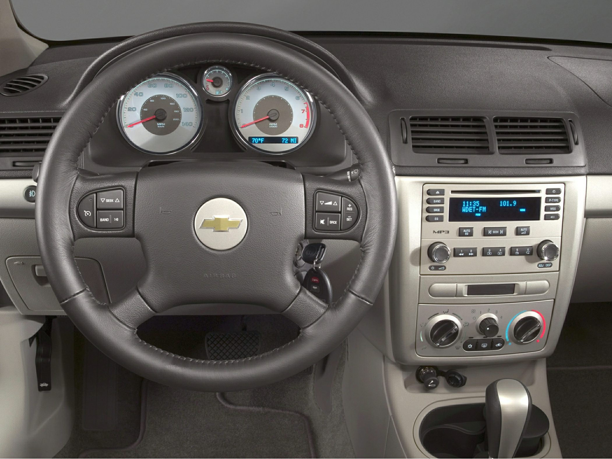 Steering wheel, dashboard instrument cluster, center console audio and climate controls