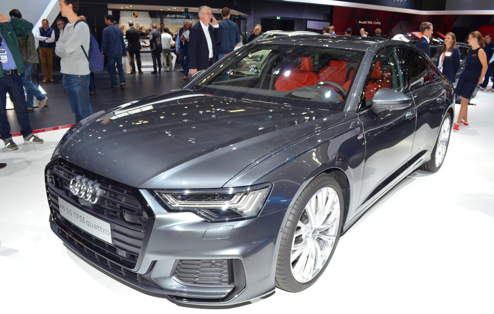 Front view of a black sedan with LED headlights and alloy wheels