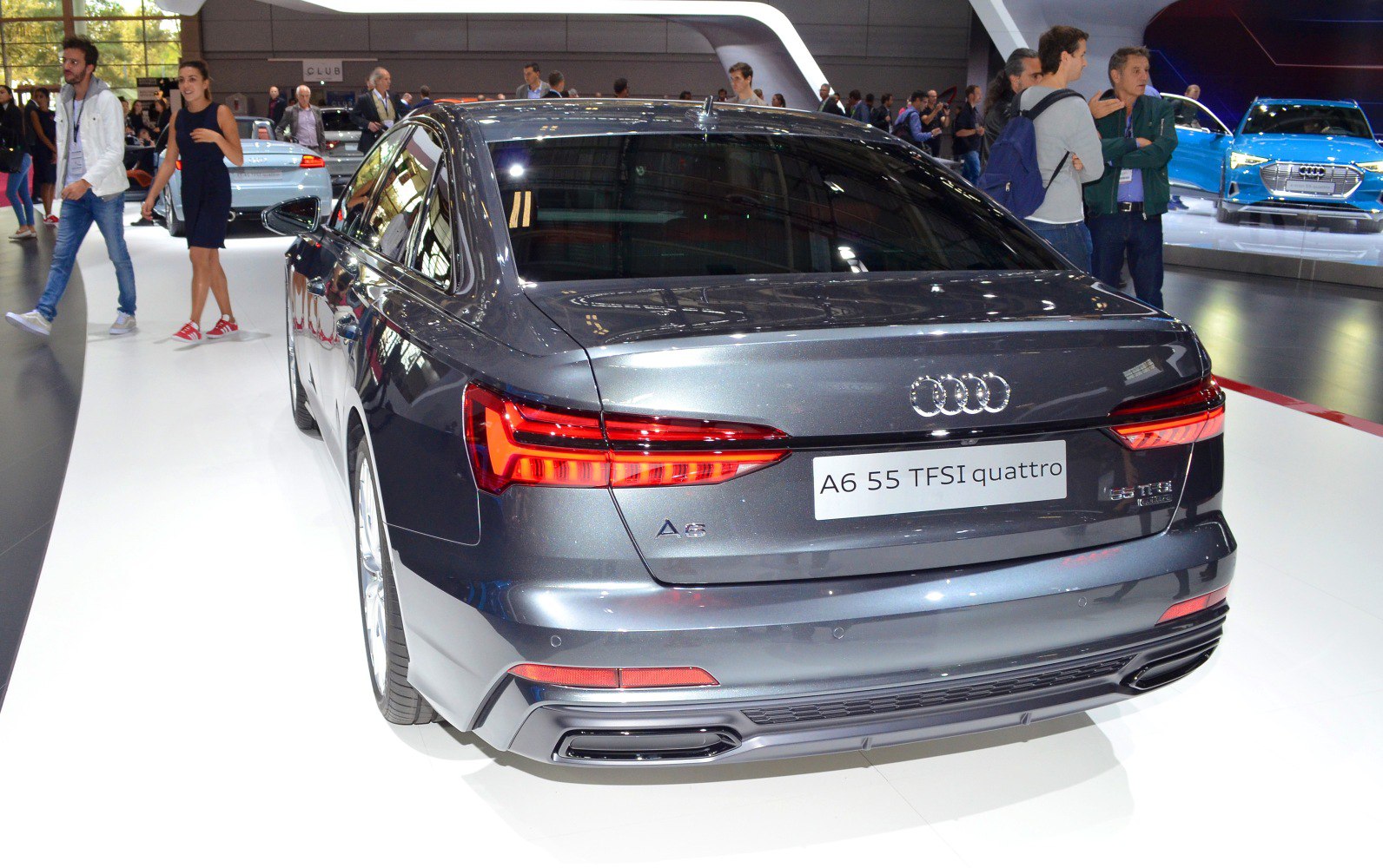 Rear side with LED tail lights, dual exhausts, sleek trunk design