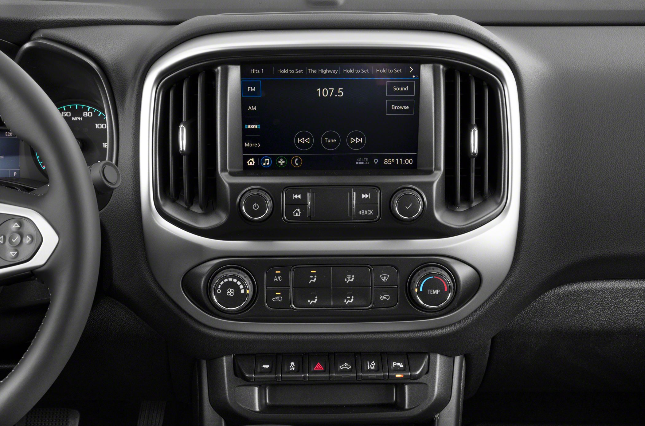 Touchscreen infotainment system and manual climate controls with knobs and buttons